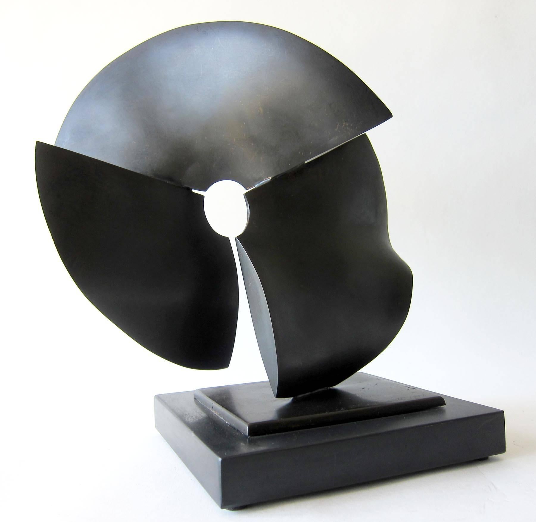 Patinated solid bronze broken circular form sculpture created by Ron Bennett, of Pittsburgh, Pennsylvania.  Sculpture measures 12