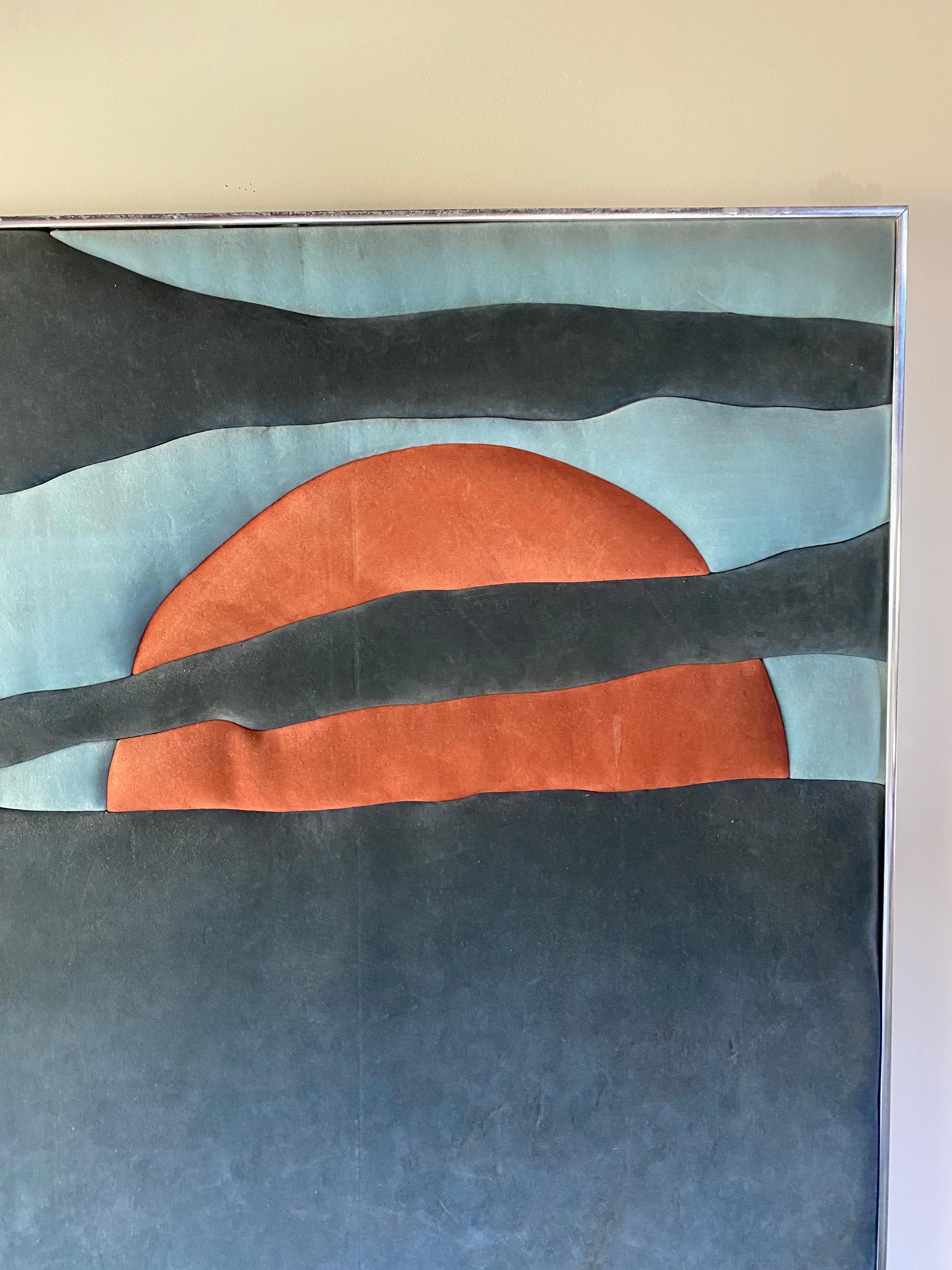 Ultrasuede tufted piece of art by Ron Brejtfus.

Showcasing a sunrise or sunset the ultrasuede used are beautiful color tones of blues and an orange.

Some slight water damage to left side.