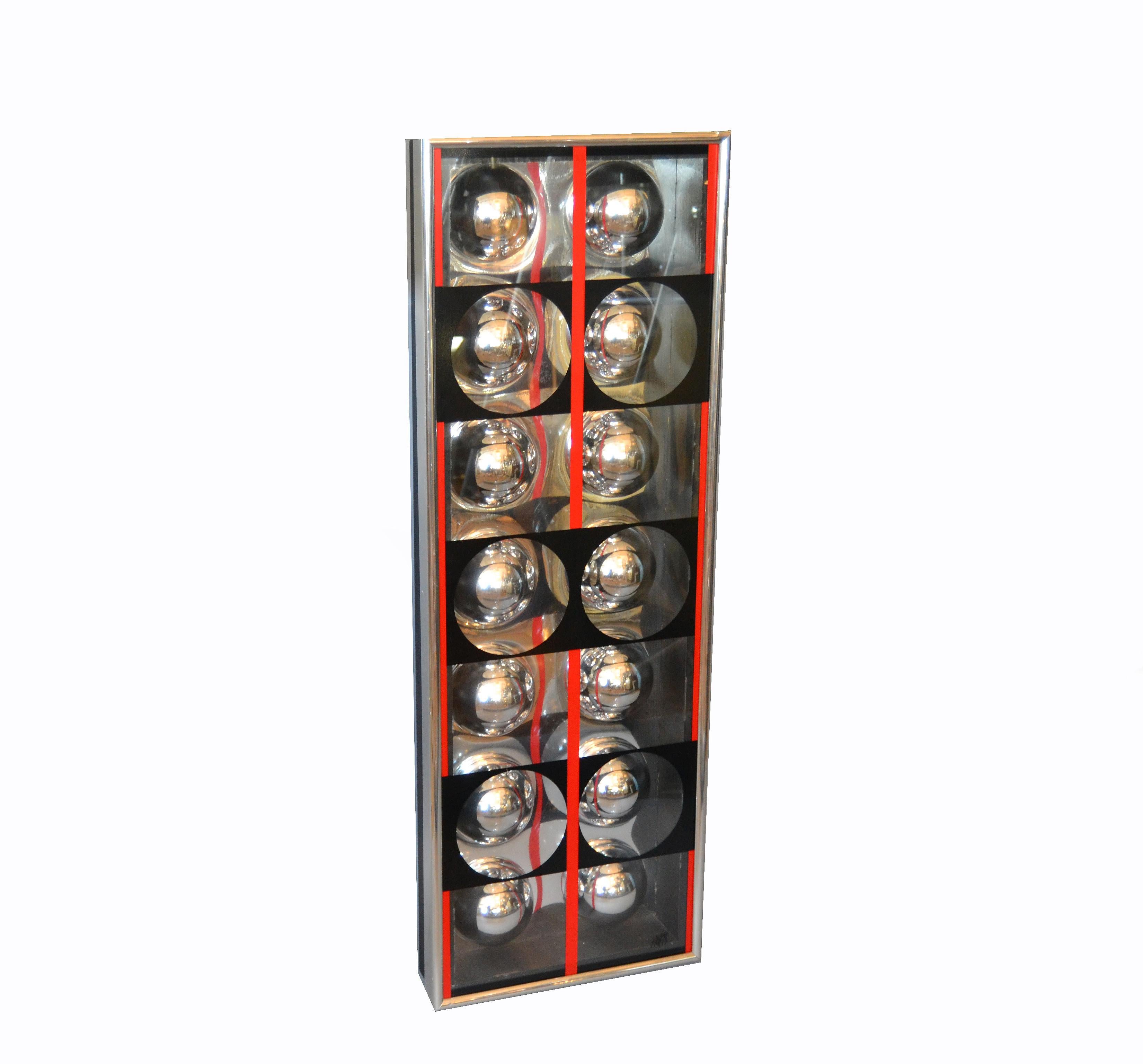 Mod wall art by Ron Fritts for RF Studios INC. The wall sculptural piece has depth- the half chrome semi-spheres are mounted under an acrylic cover with graphic designs. 
Signed 'Fritts' at the front right corner and labeled on the wooden back with