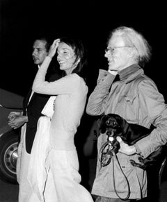 Fred Hughes, Lee Radziwill, and Andy Warhol with dog Archie, Montauk, New York