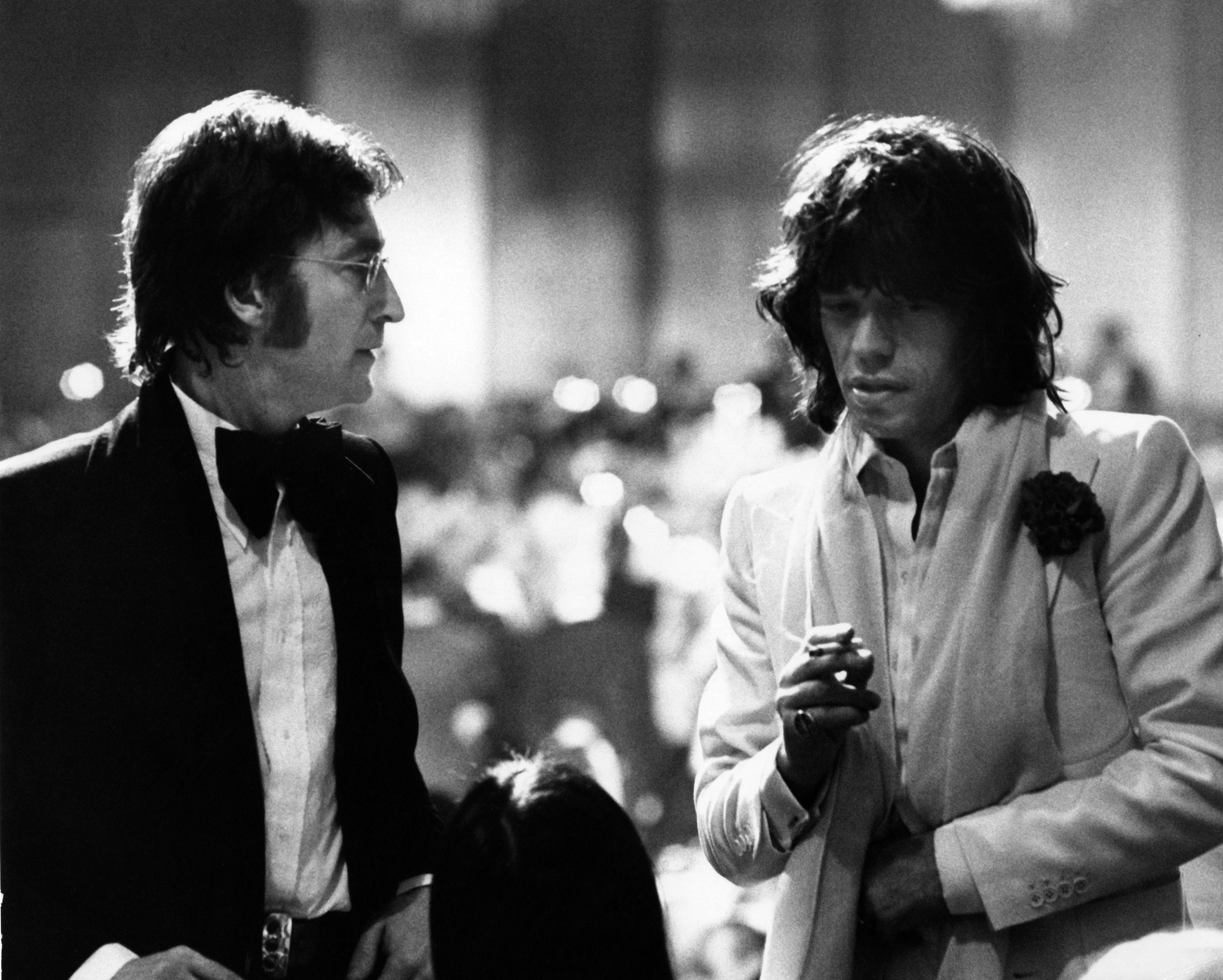 Ron Galella Black and White Photograph - John Lennon and Mick Jagger, Los Angeles, California, 1974