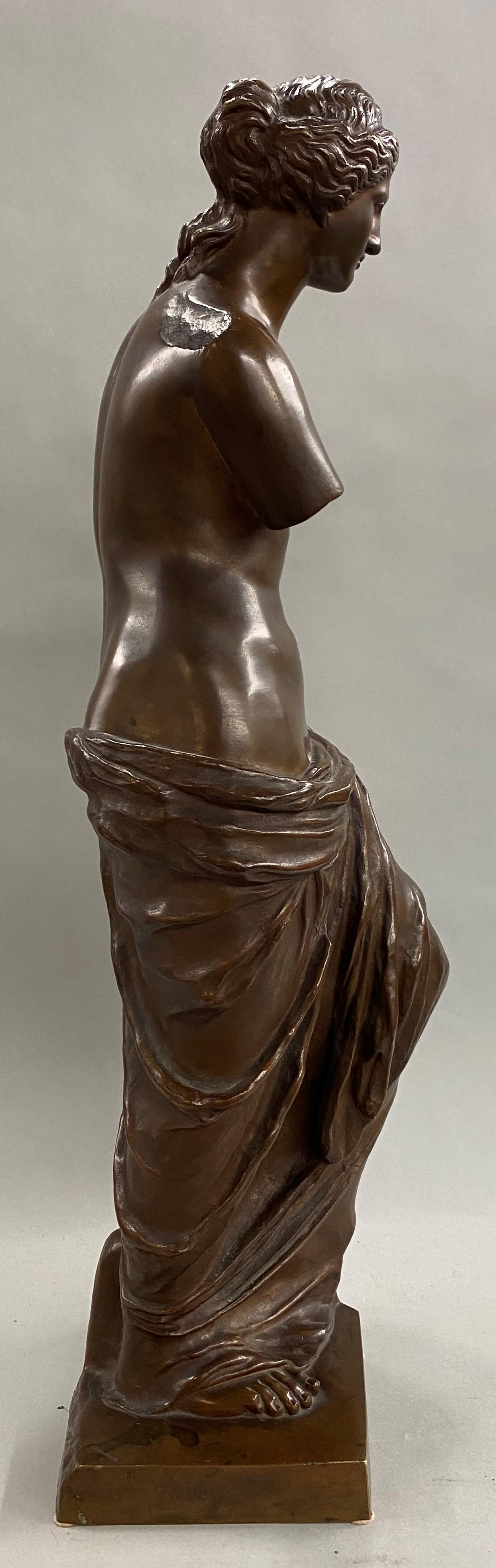 A fine patinated bronze of the iconic classic Greek statue of Venus de Milo, incised by artist on base side (possibly 19th century French sculptor Ron Liod Sauvage) and stamped “Tiffany & Co” on base top corner, dating the the late 19th century in