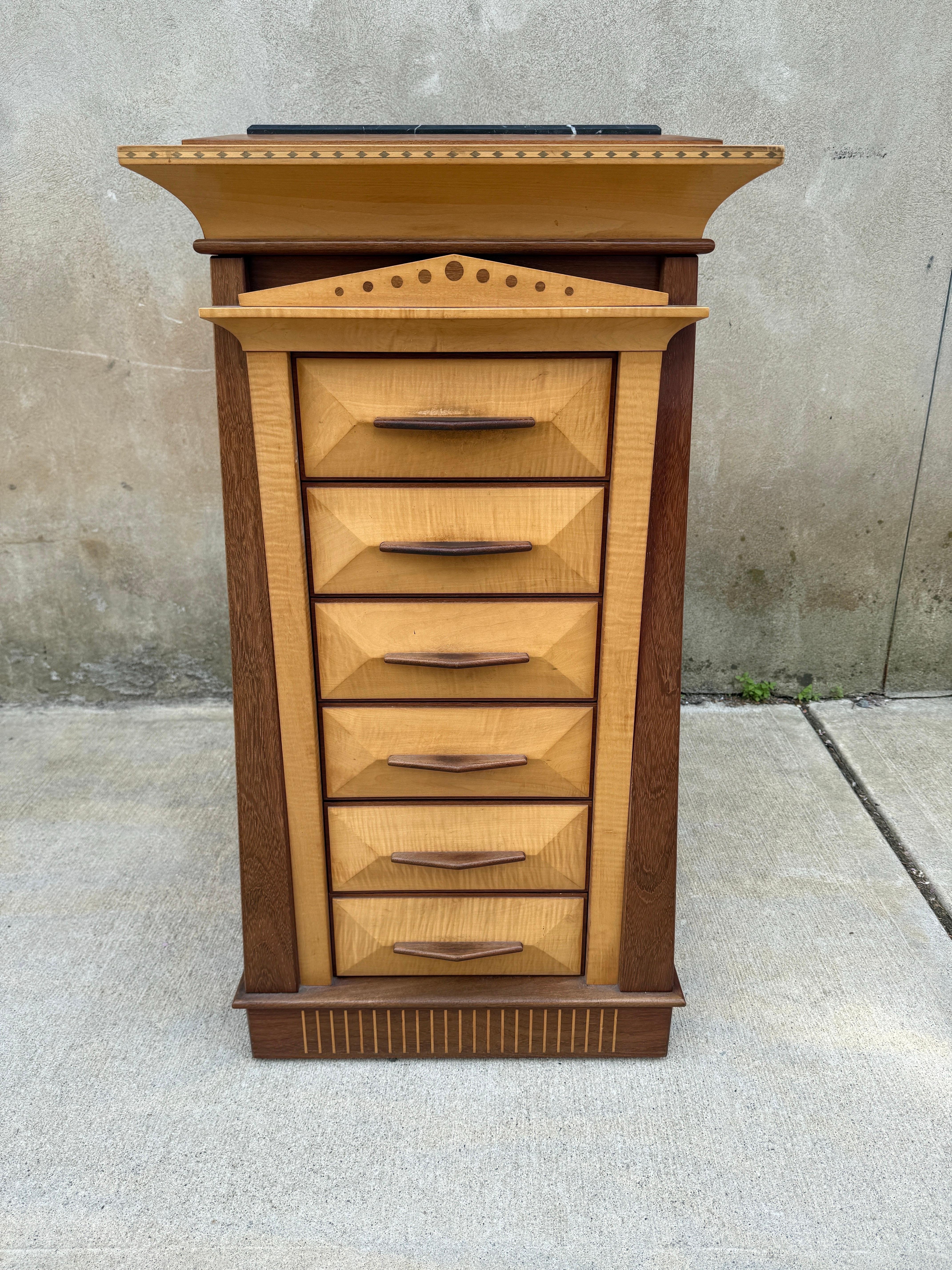 Amazing hand made Ron Puckett Custom Made Pedestal Cabinet NYC 1980’s, one of one, signed. Expert craftsmanship and marquetry. Marble top and wonderful dovetail drawers.  Consists of figured maple and purple heart. 
 Original purchase documentation