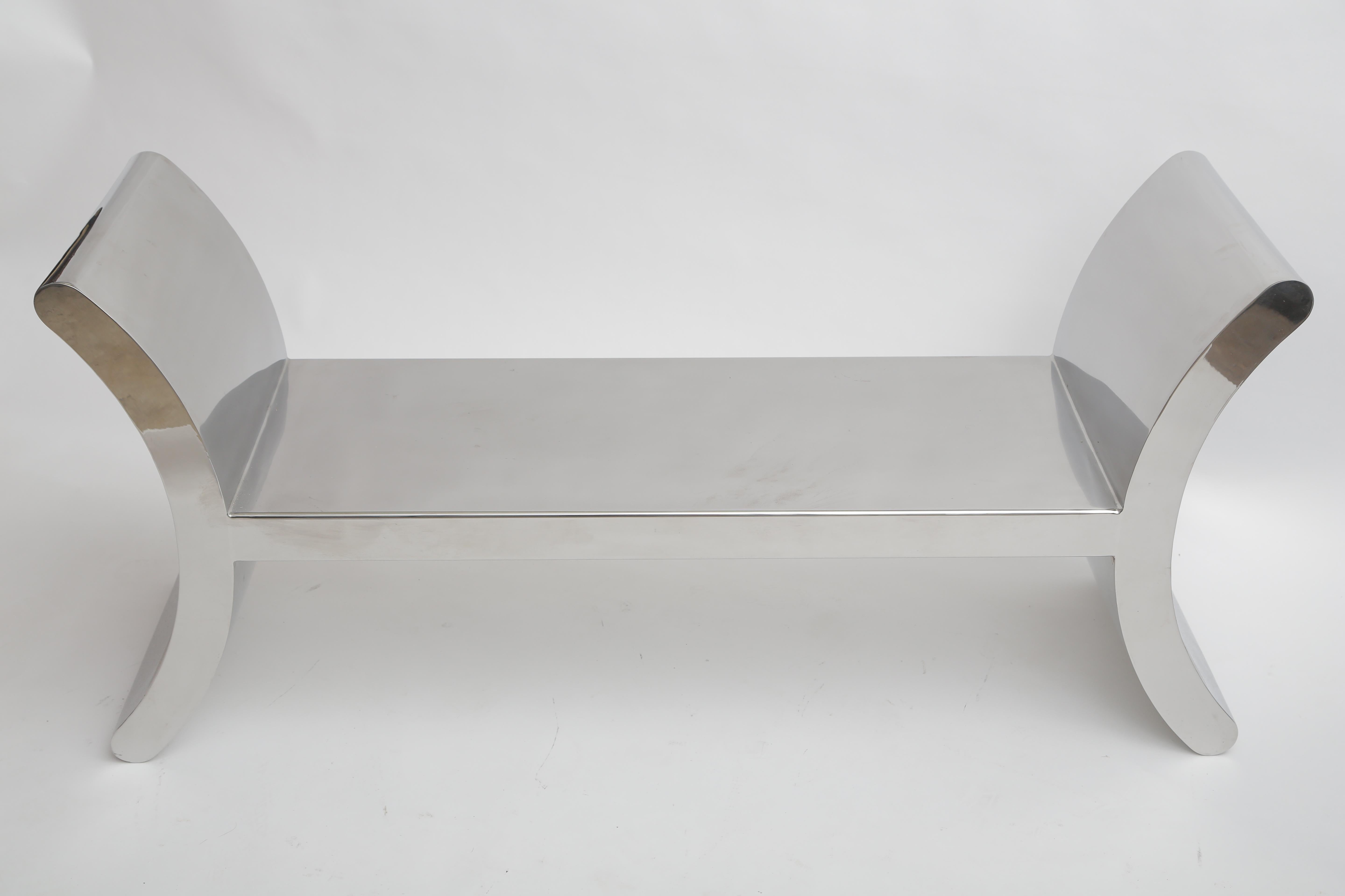 Mirror-polished steel bench, great form.
      