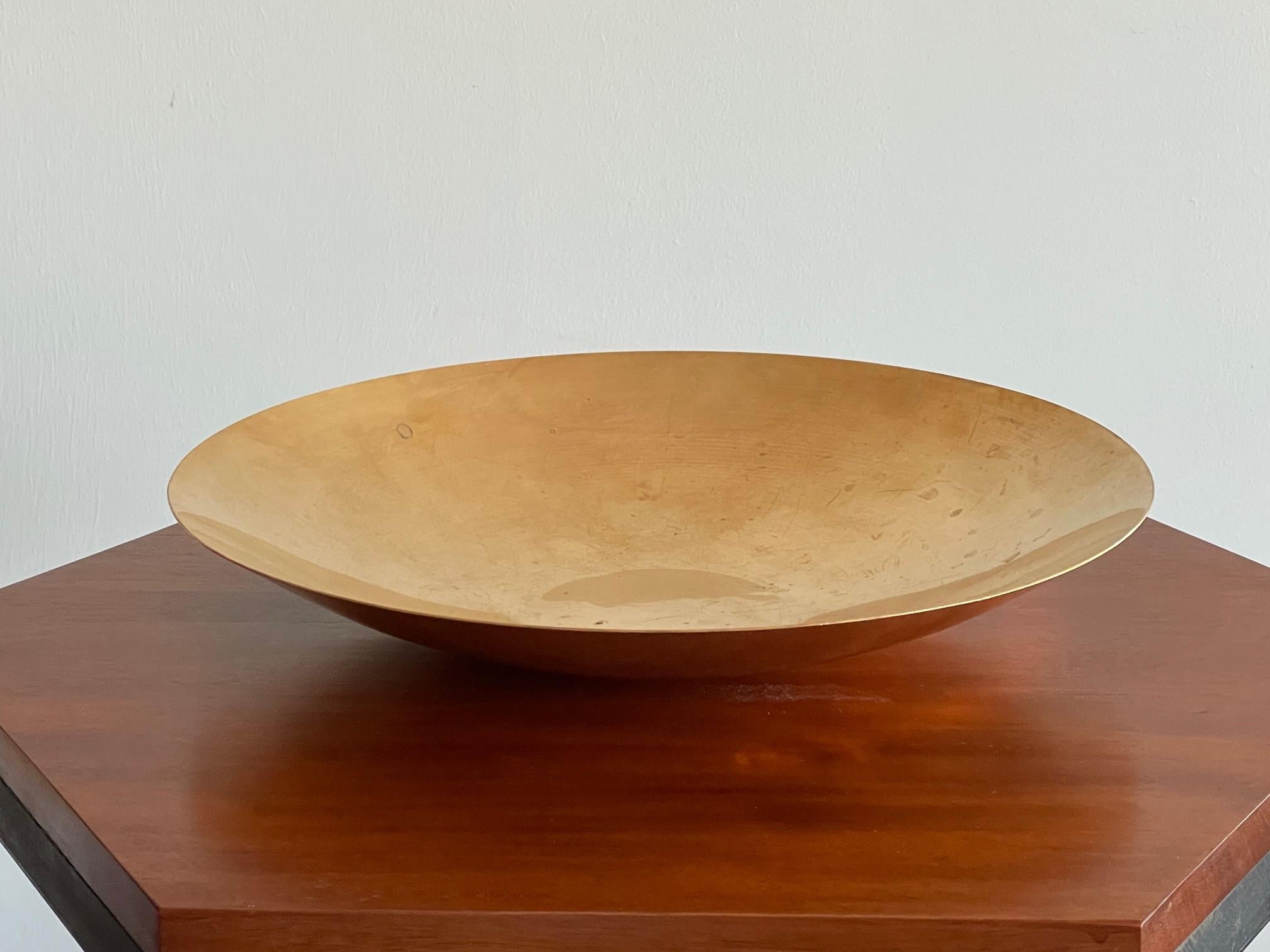 A handmade brass bowl by jeweler and silversmith Ronald Pearson. This is a large one measuring 13.5