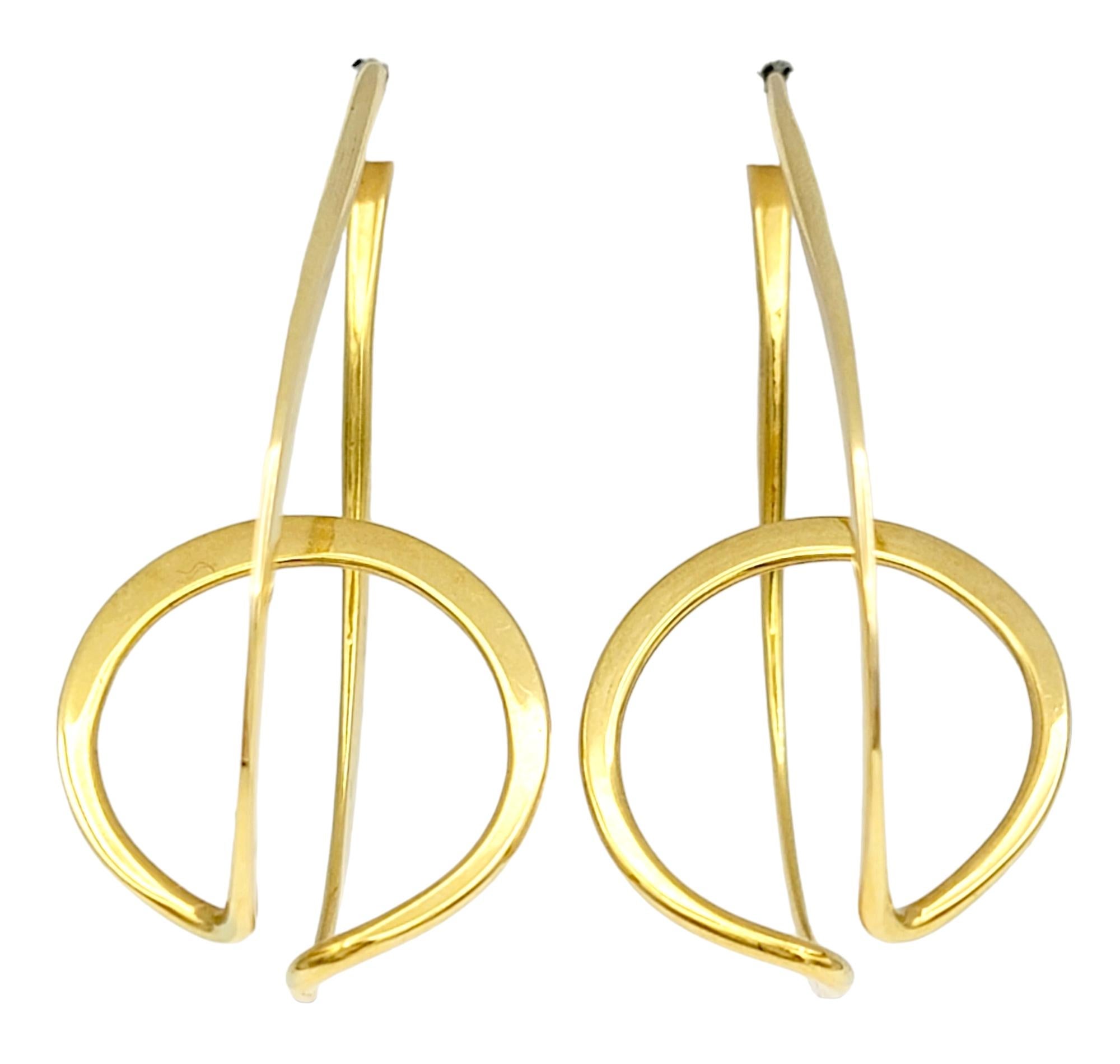 Elegance meets innovation in this distinctive pair of gold earrings, a masterpiece of design by Ronald Pearson. Crafted from 14-karat forged gold, these earrings showcase a seamless blend of creativity and quality.

The earring is a single unbroken