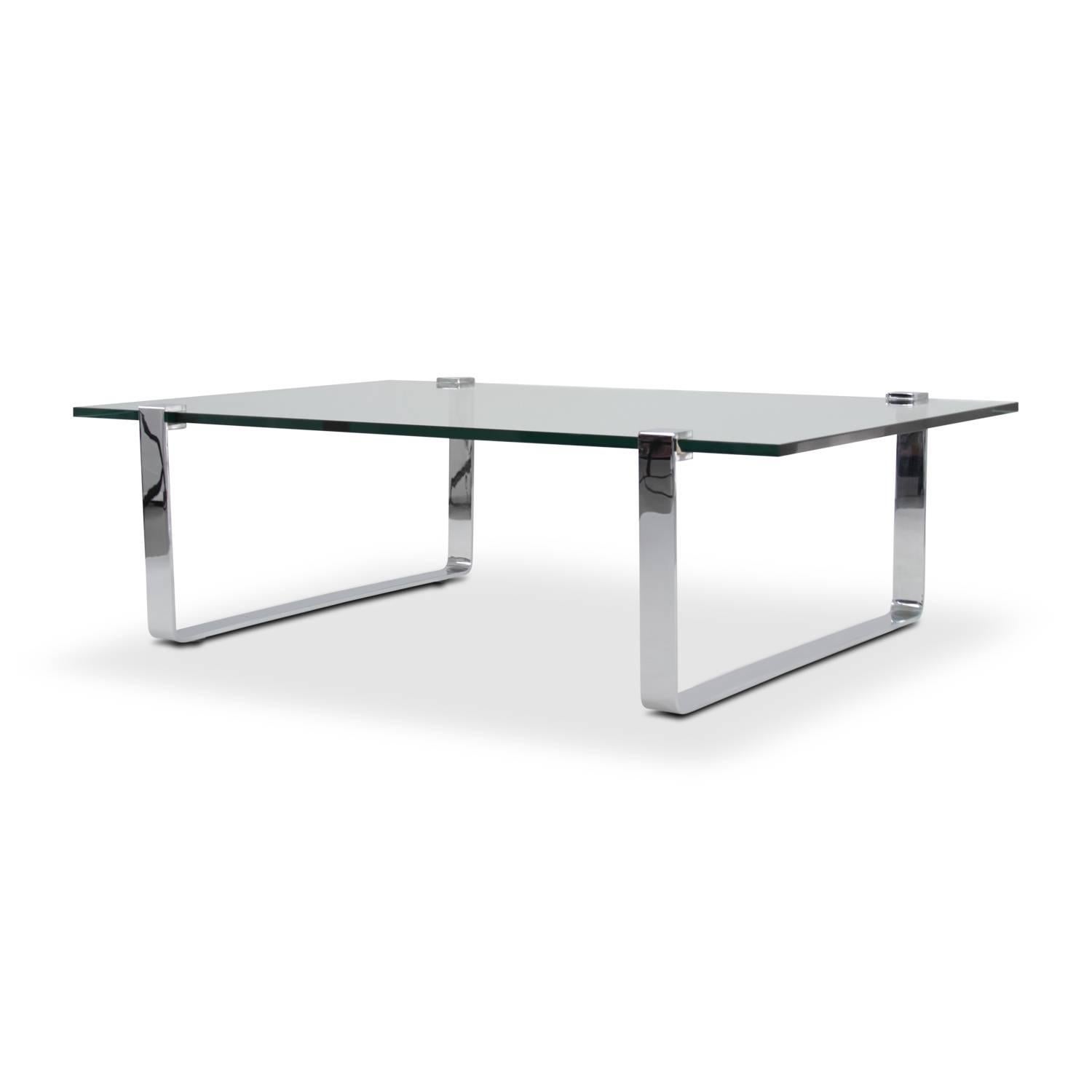 Rectangular Ronald Schmitt coffee table with a 19 mm glass top and runners in solid steel polished chrome. Modell K 831 by Friedrich Wilhelm Möller.



  