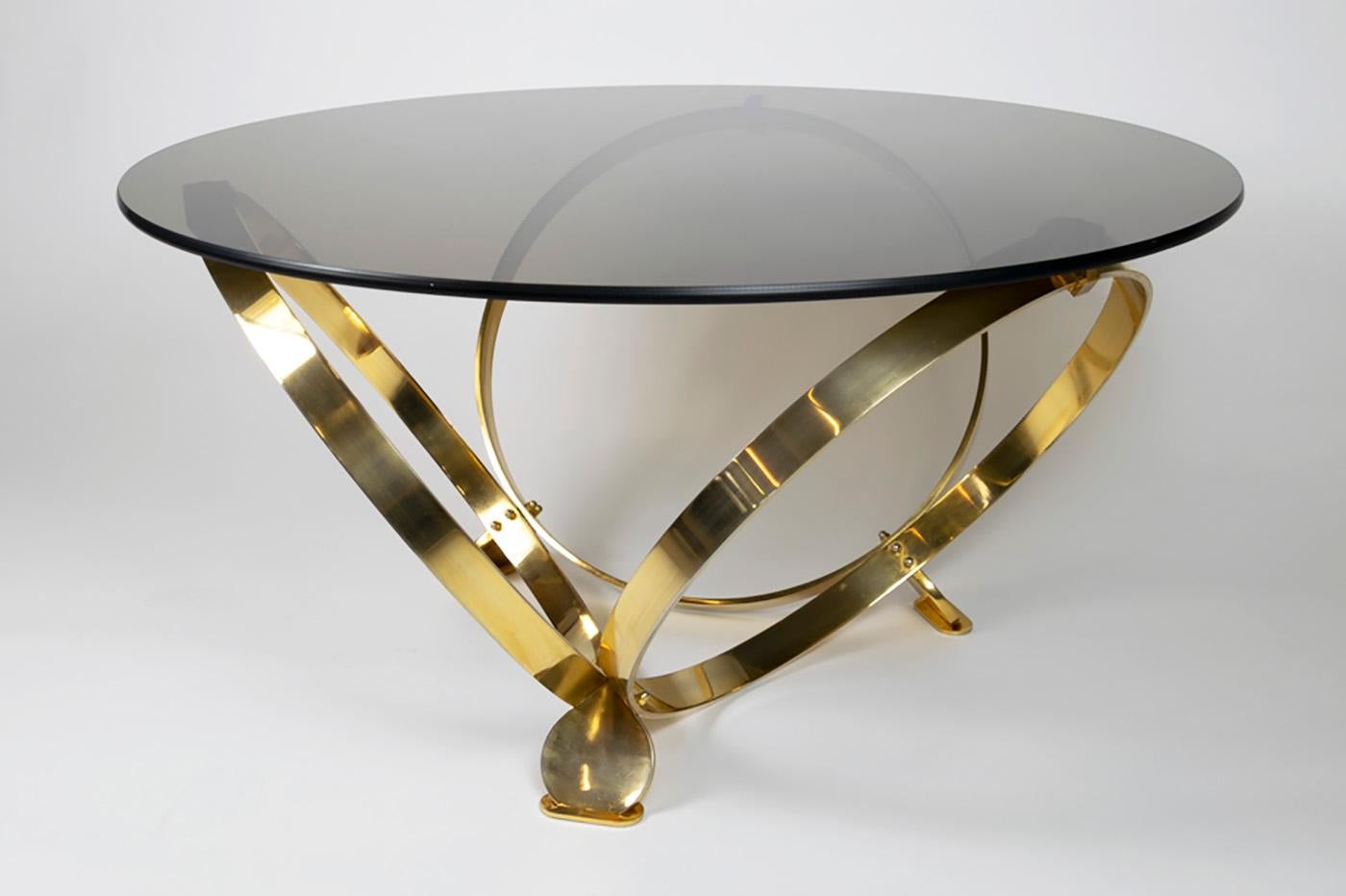 Ronald Schmitt coffee table in brass by Knut Hesterberg completed with a smoked glass top.
Very nice vintage condition.