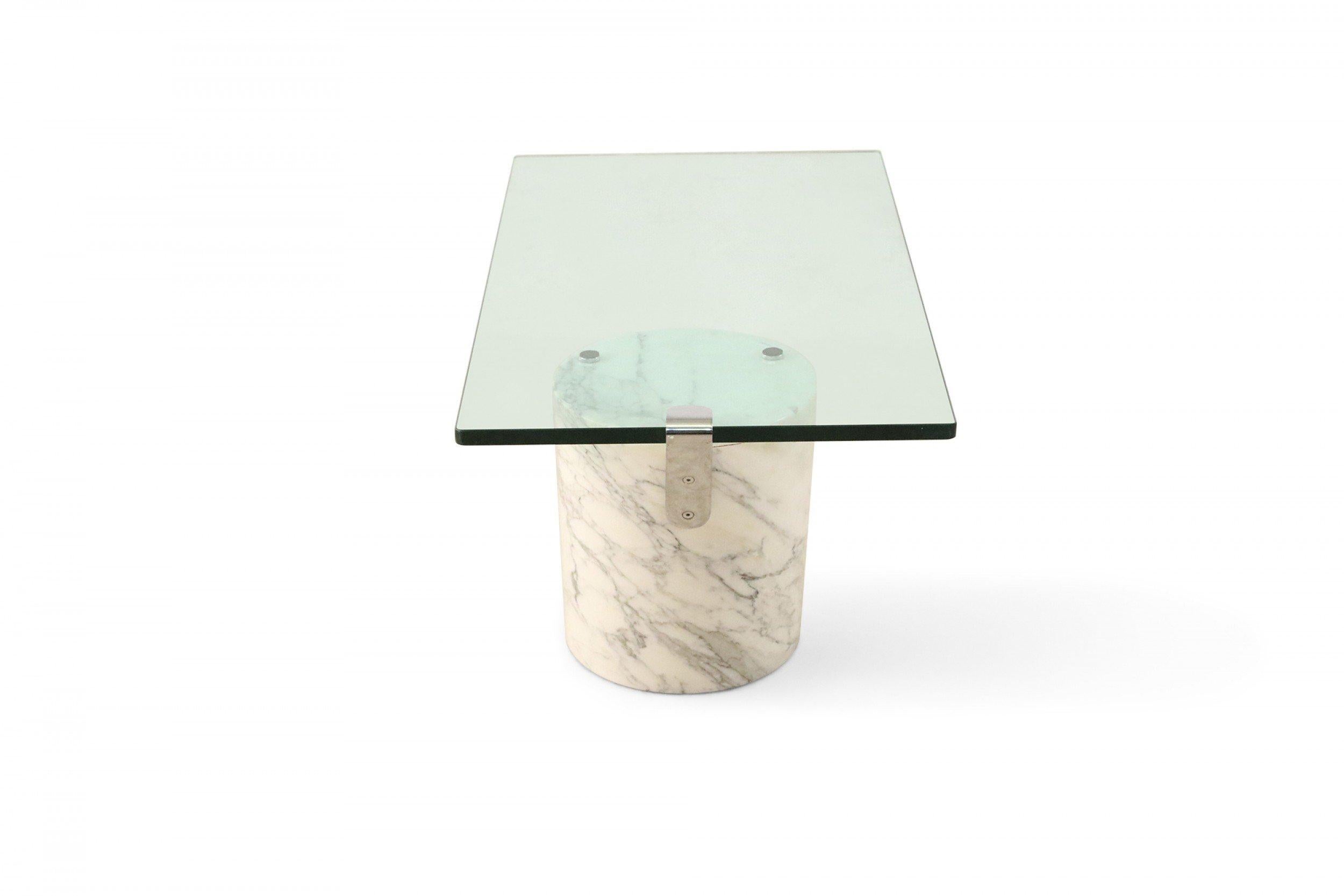 Mid-Century Modern German coffee table with angled cylindrical white Carrara marble base and floating rectangular glass tabletop (RONALD SCHMITT FOR BRUETON).