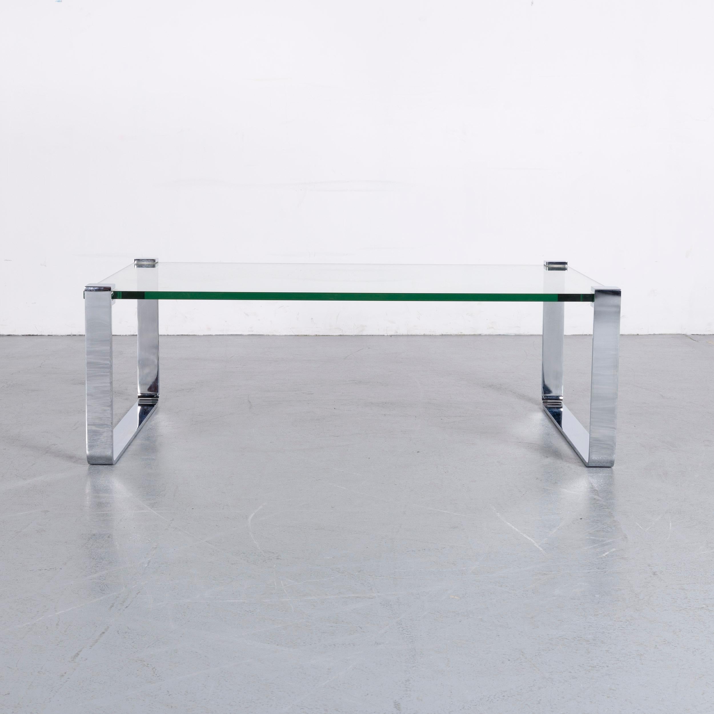 We bring to you an Ronald Schmitt glass coffee table.











 