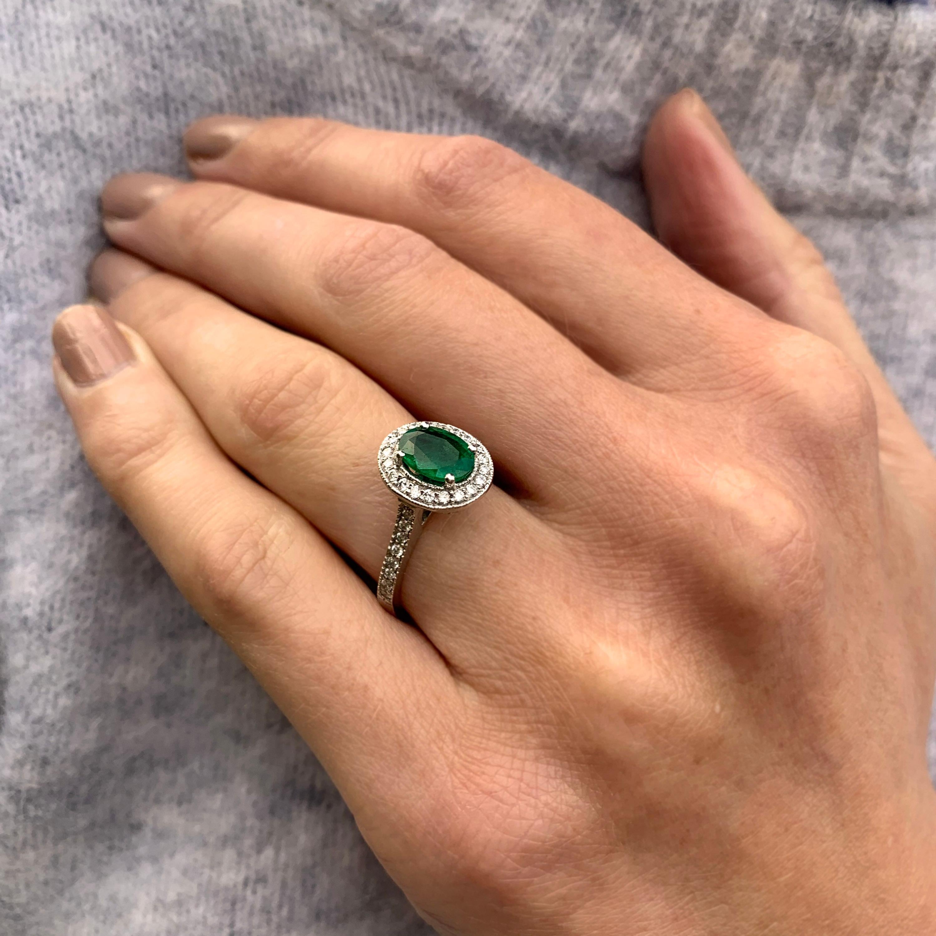 A perfectly proportioned oval shape emerald (1.02ct) sits centre stage in this beautiful ring crafted in 18k white gold. The vintage setting detail is perfect, complimenting the main stone. A perfectly shaped surround and shoulders filled with