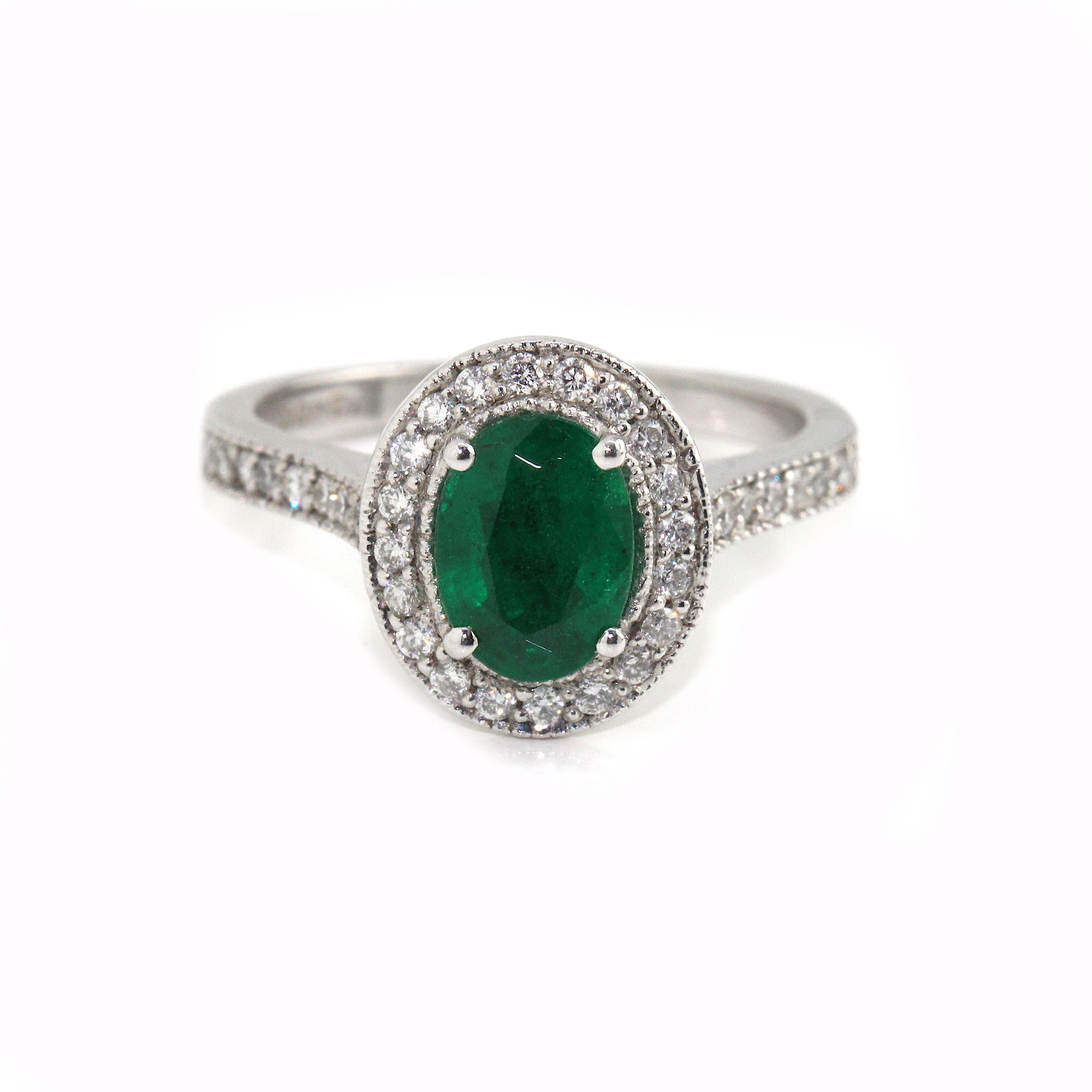 Oval Cut 18 Karat White Gold Emerald and Diamond Ring For Sale