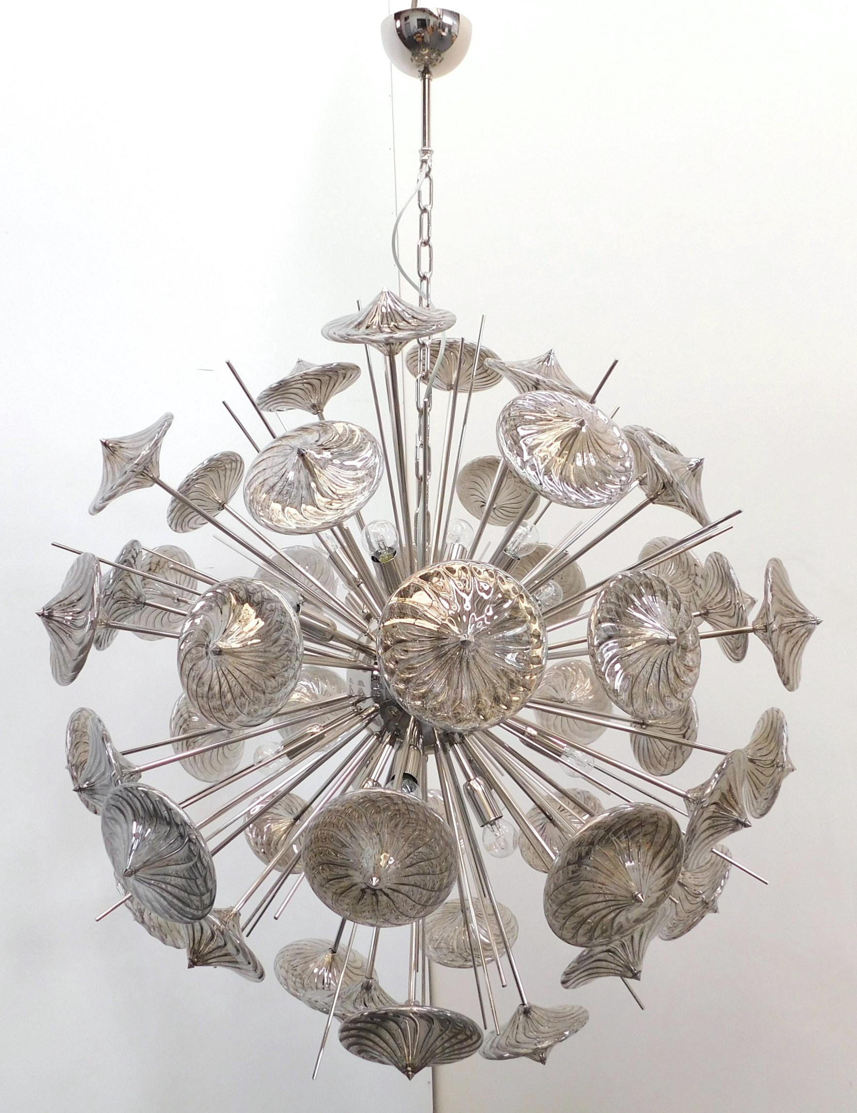 Italian modern Sputnik chandelier with smoky gray Pyrex borosilicate glass, hand blown to produce a spiraled effect mounted on polished nickel metal finish / Designed by Fabio Bergomi for Fabio Ltd / Made in Italy
16 lights / E26 or E27 type / max