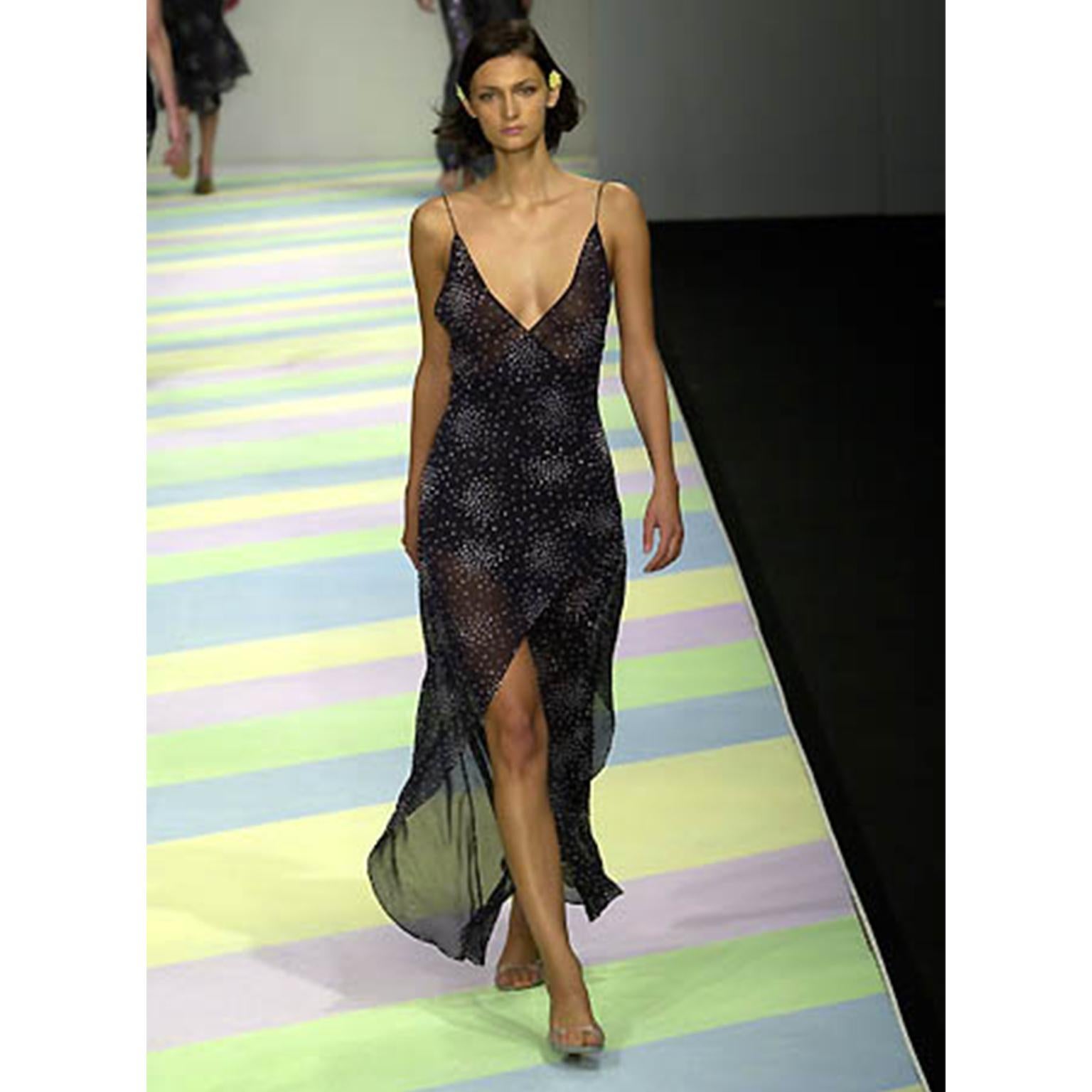This is a really fun vintage Y2K Ronit Zilkha London slip dress from her Spring Summer 2001 collection. This runway documented evening dress is made of 90% silk and 10% polyester. The dress has silver white painted dots and we love the asymmetrical