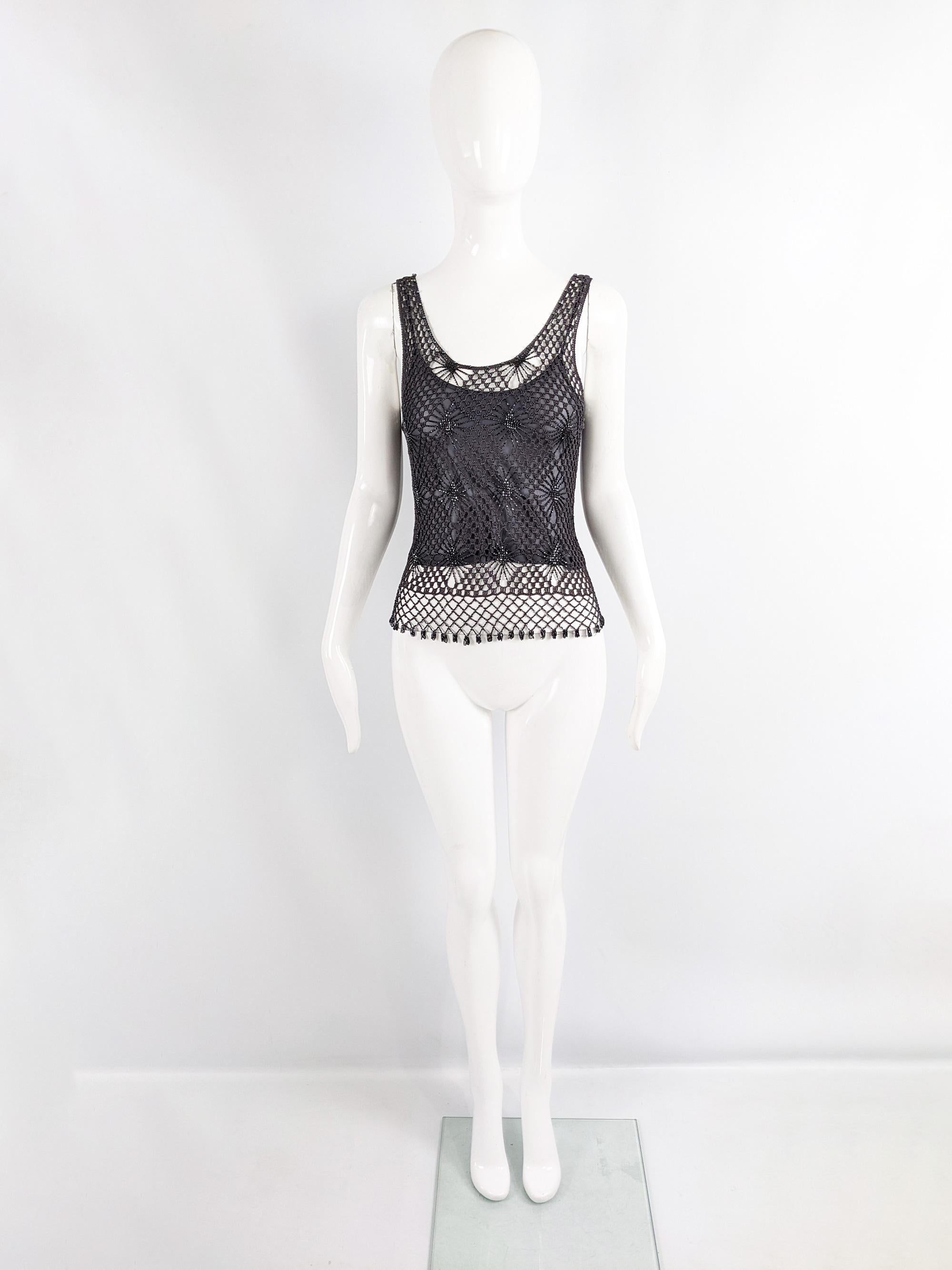 A fabulous vintage womens sleeveless top from the late 90s / early 2000s by luxury British fashion designer, Ronit Zilkha. In a dark slate grey crochet fabric with beading throughout. Underneath the crochet is a sheer mesh crop top.

Size: