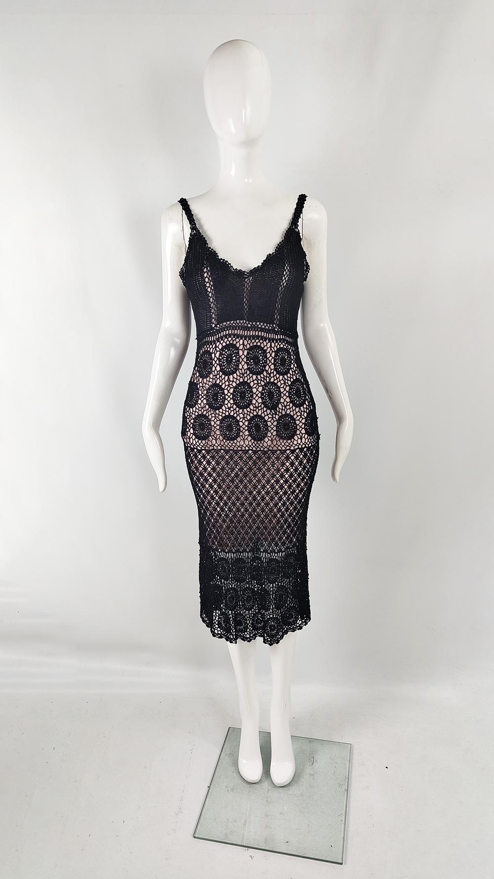 A fabulous vintage womens dress from the late 90s / early 2000s by luxury British fashion designer, Ronit Zilkha. In a black open knit crochet with a pink underlining. The straps and hem are dotted with beading adding a luxe feel. Perfect for a