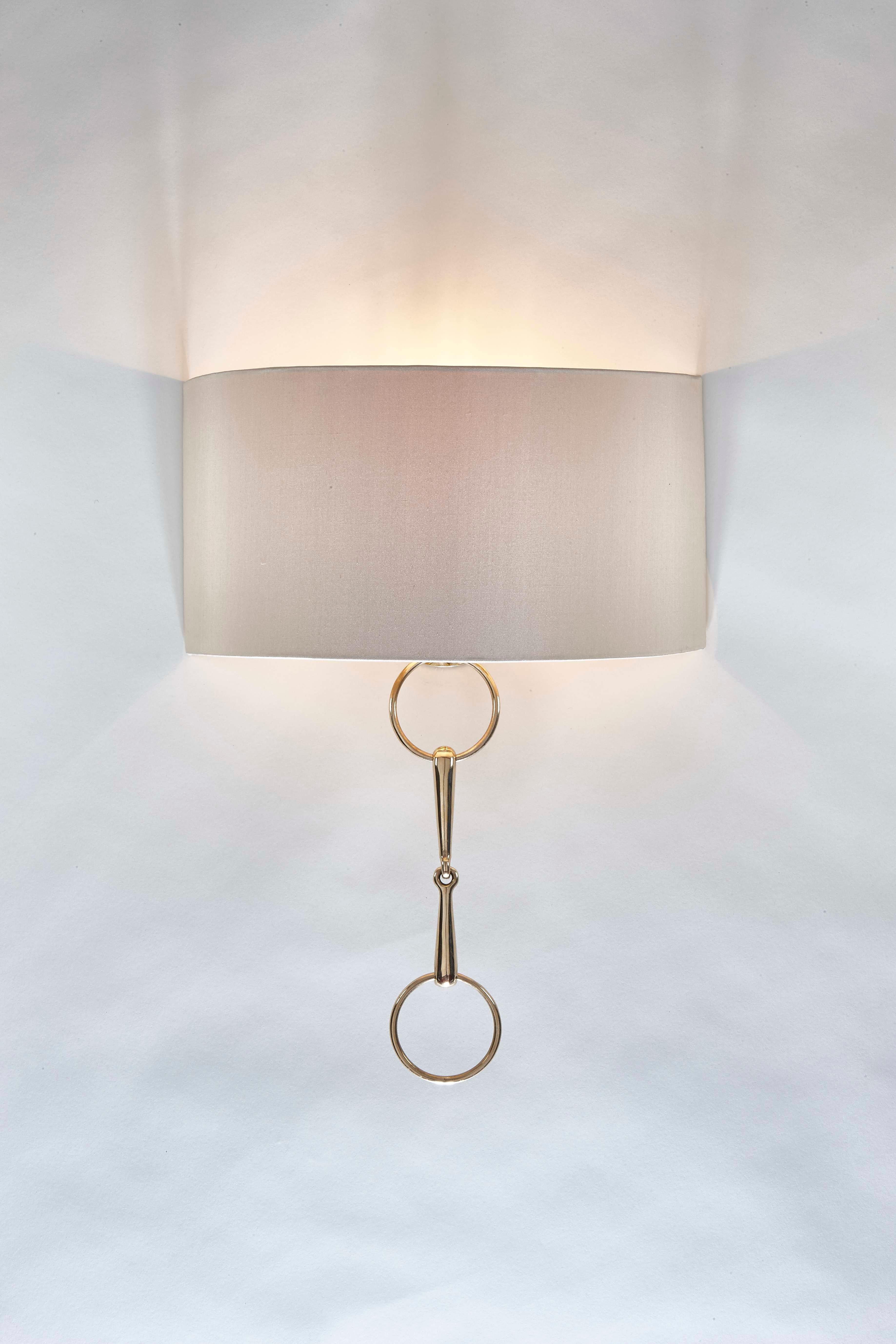 Named ‘Ronnie’ after a horse very dear to Cocovara’s founder. These handmade wall lights have a soft bespoke half-shade with a gorgeous polished brass snaffle as its centrepiece. Available in both long and short versions perfect for any country home