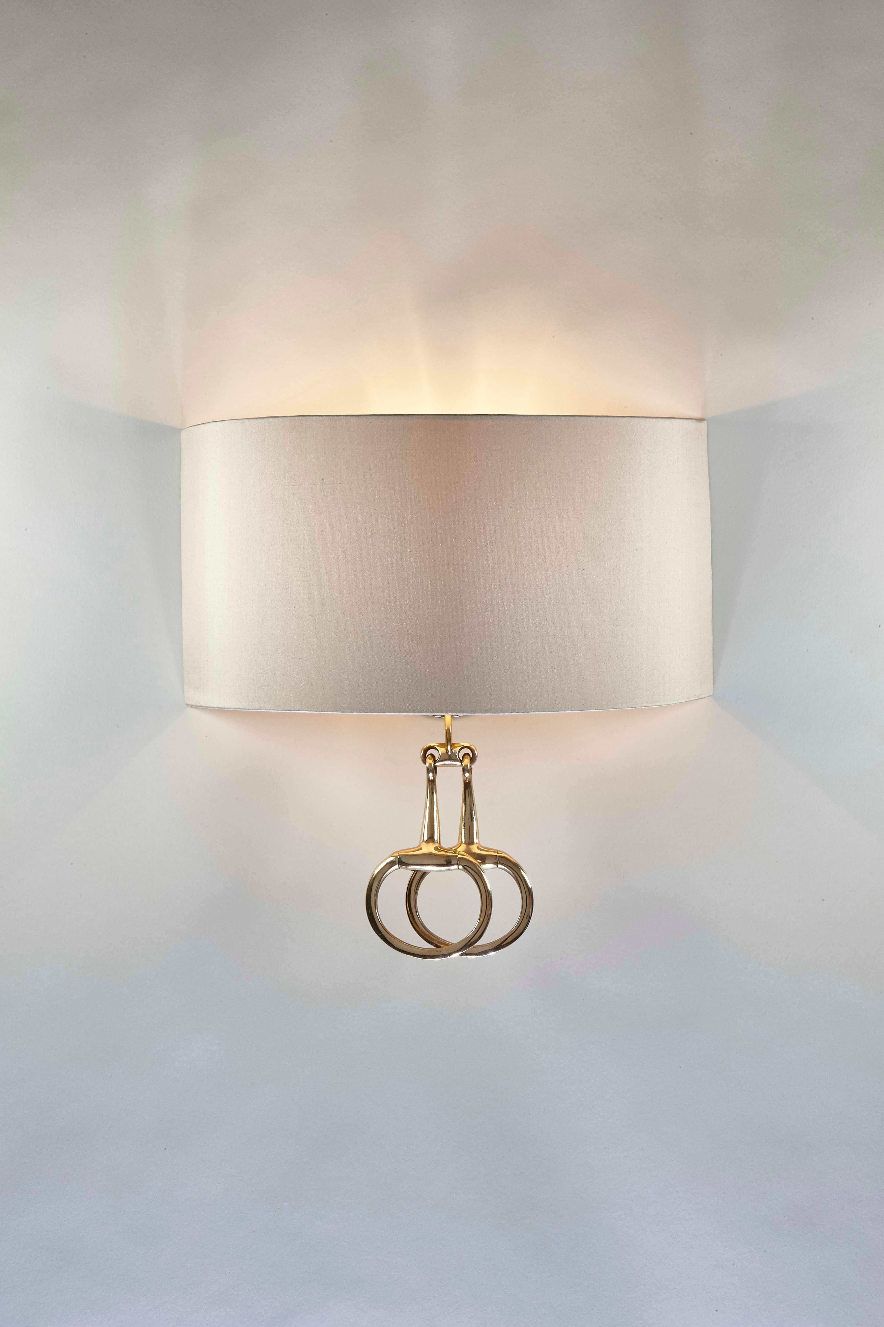 Named ‘Ronnie’ after a horse very dear to Cocovara’s founder. These handmade wall lights have a soft bespoke half-shade with a gorgeous polished brass snaffle as its centrepiece. Available in both long and short versions perfect for any country home