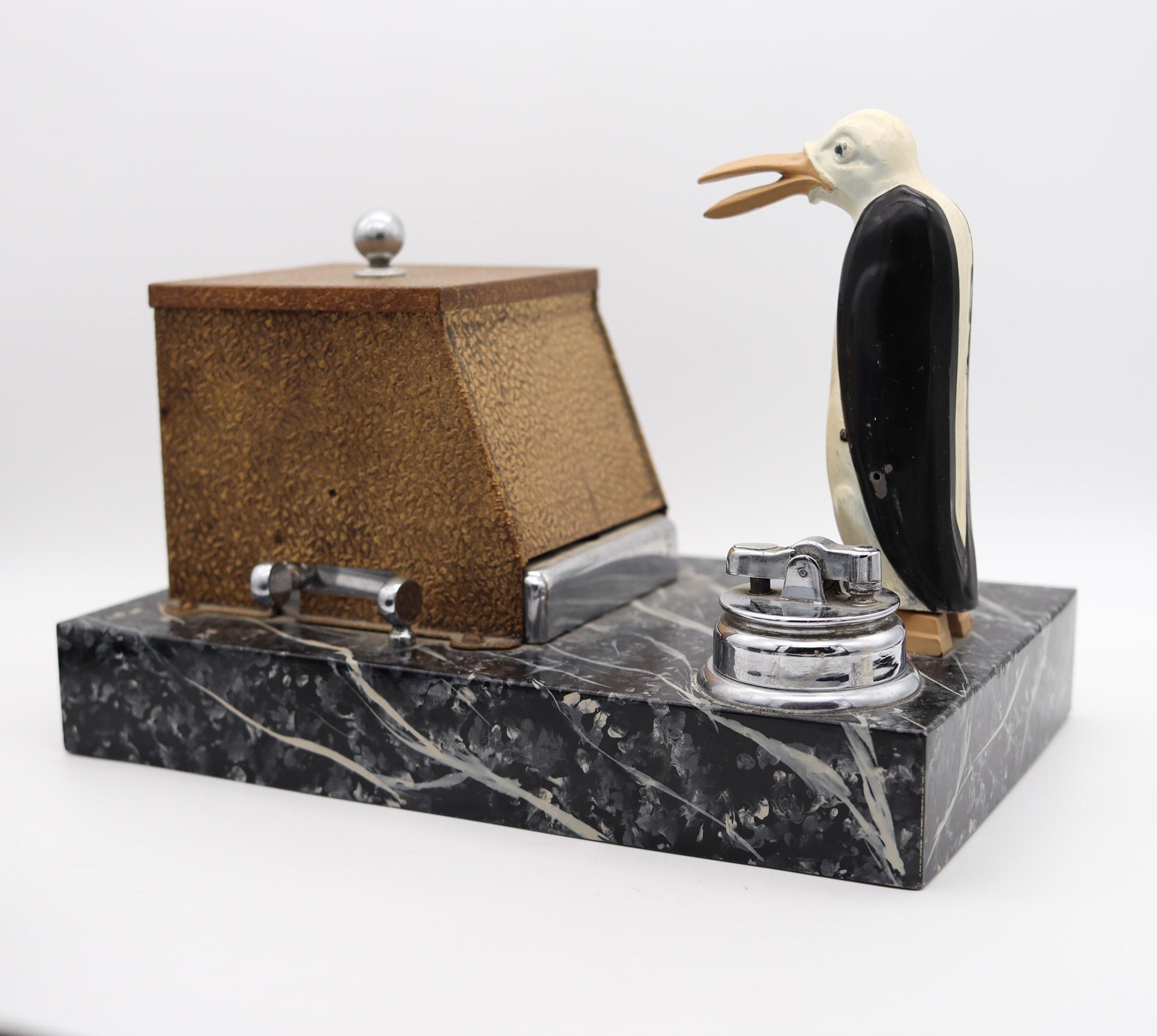 Art deco magic penguin mechanical dispenser box designed by Ronson.

A beautiful, exceedingly rare and very decorative mechanical dispenser desk box, created in the city of Newark, New Jersey in the United States by The Ronson Art Metal Works Co.