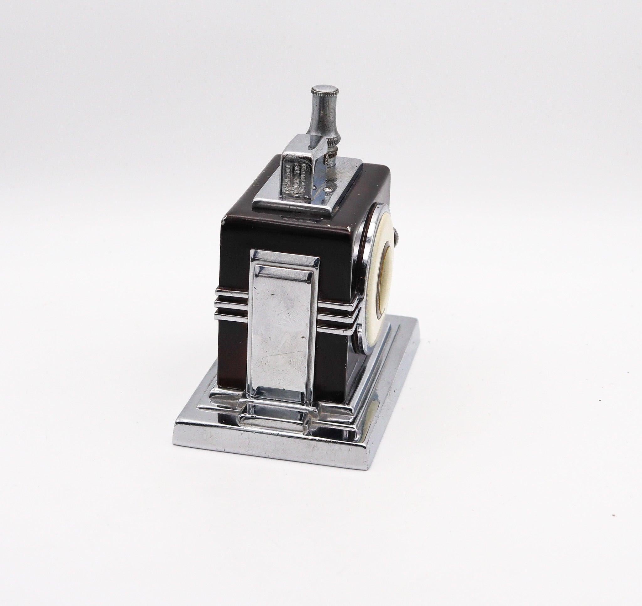 A Maltese clock & touch tip lighter designed by Ronson.

This is an extremely rare Ronson Maltese clock Touch-Tip lighter. This is a very iconic piece made in 1936 at Newark, New Jersey in the United States by the Ronson Art Metal Works Inc. This