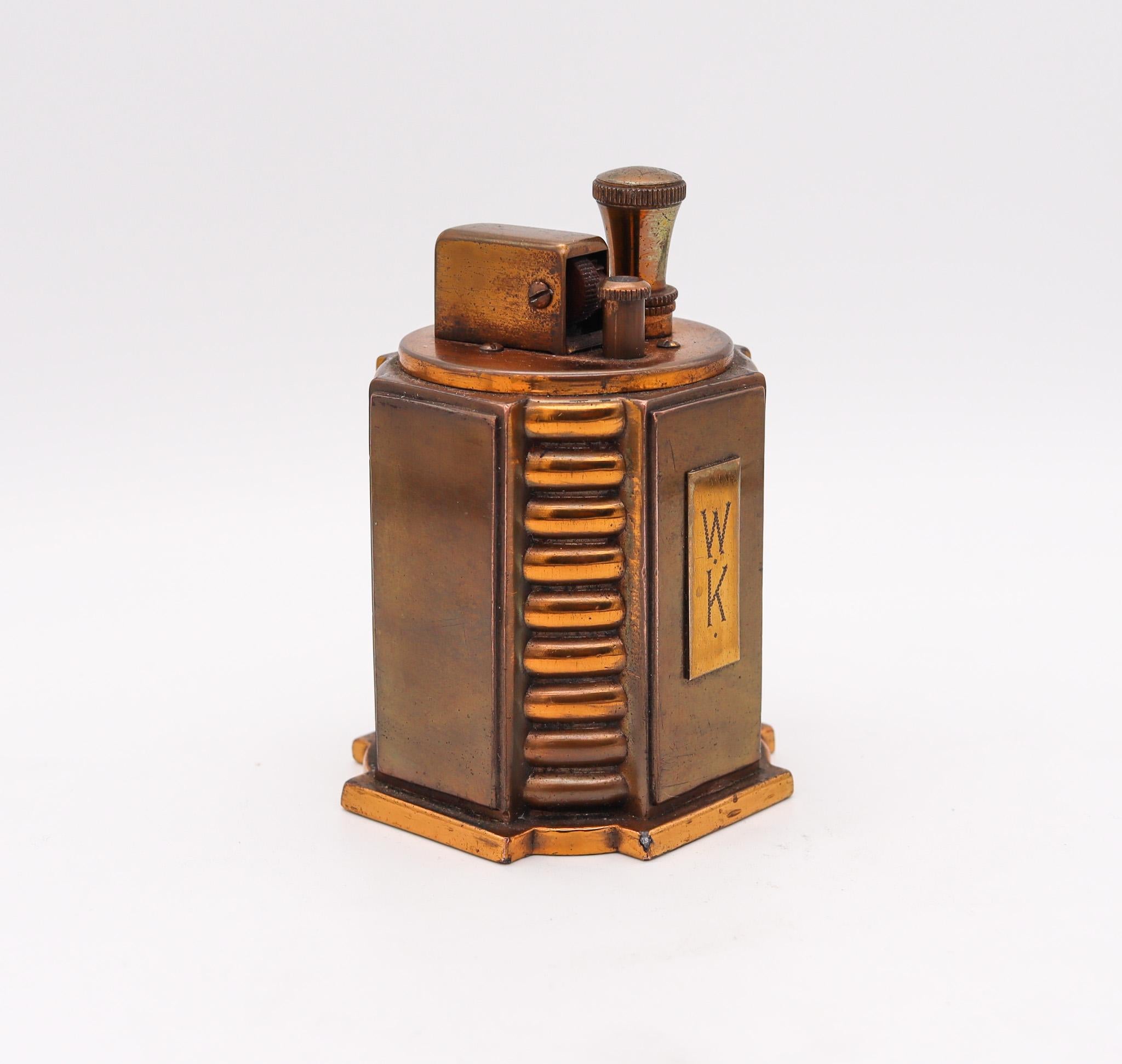 A bronze Tourette desk lighter designed by Ronson.

Very rare desk table Touch-Tip lighter, created in Newark New Jersey by Ronson, at The Art Metal Works Co. during the art deco period, back in the 1936. This is a very unusual Turret lighter