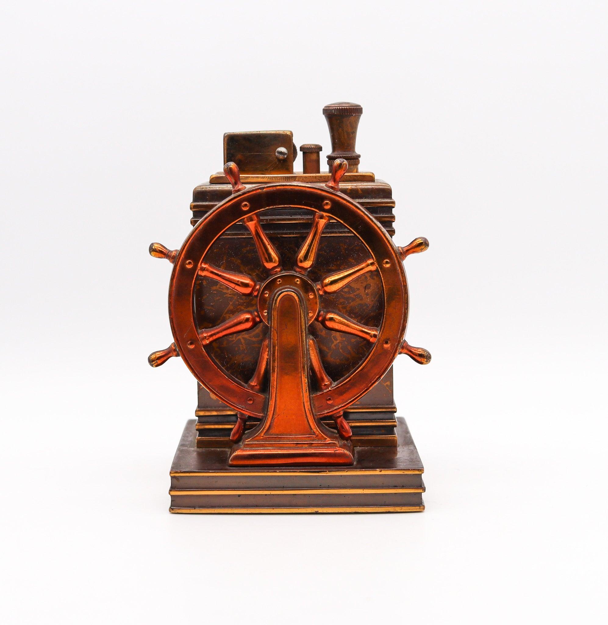 Dureum brass desk Nautica lighter designed by Ronson.

This very rare Ronson Nautica Classic Touch-Tip lighter was made in 1938 by the Ronson Art Metal Works Inc. located in Newark, New Jersey in the United States. This lighter began a very