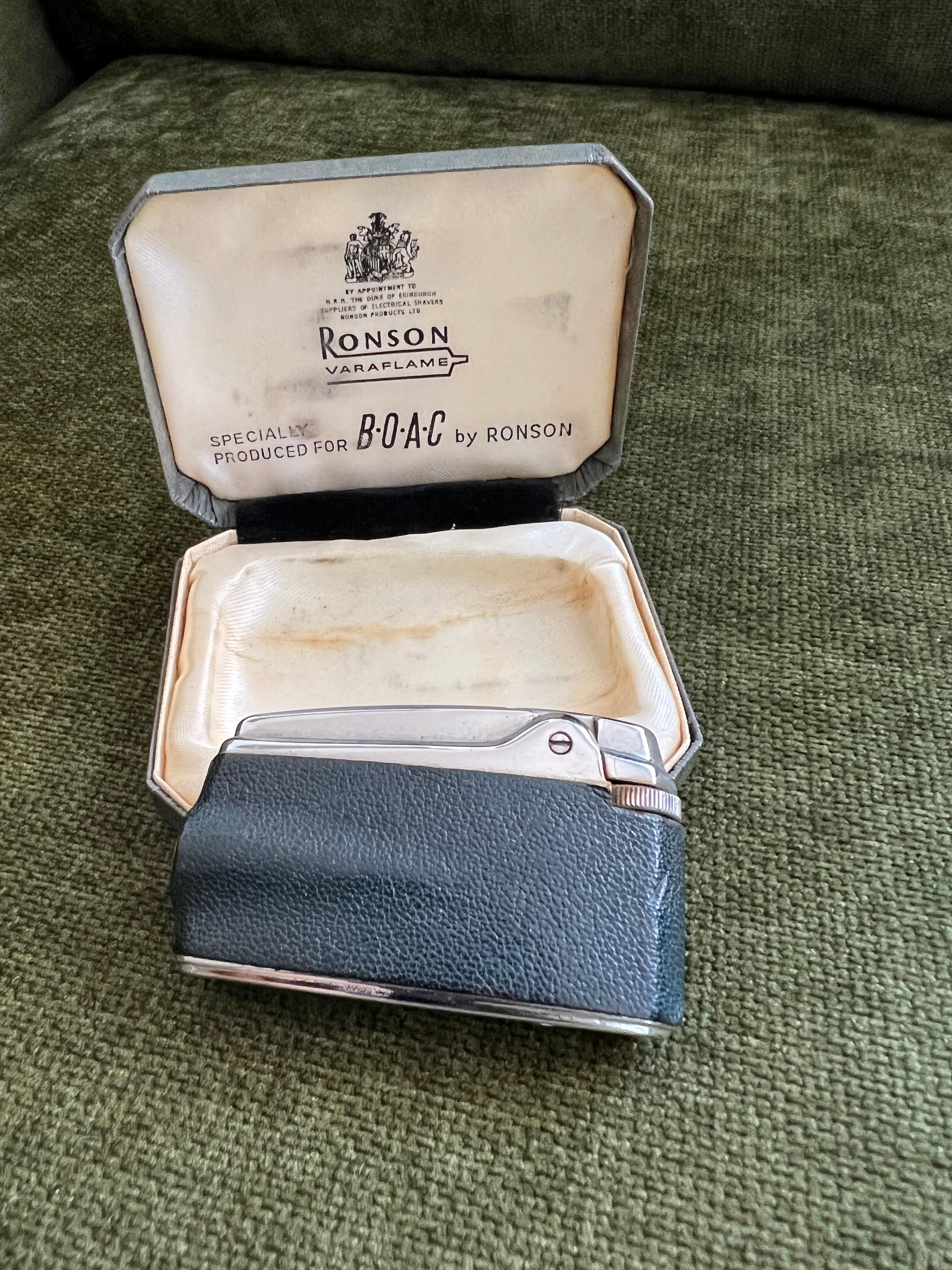 Ronson vintage vor 1974 ronson varaflame für BOAC (British Overseas Airways Corporation) 
verwendet, aber ist im Grunde neu atemberaubende Silber vergoldet mit schwarzem Leder wickeln kommt mit original grünen Muschelkoffer mit speziell für BOAC von