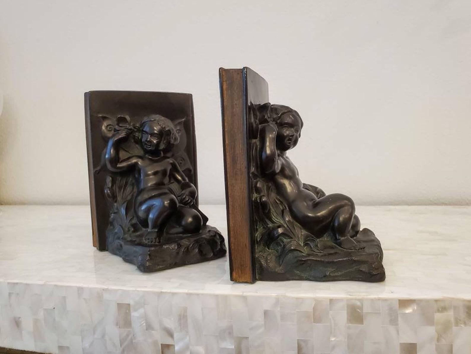 A fabulous pair of high-quality patinated bronze American Art Deco period bookends by Ronson Art Metal Works, circa mid-1920s, #7072, tilted 