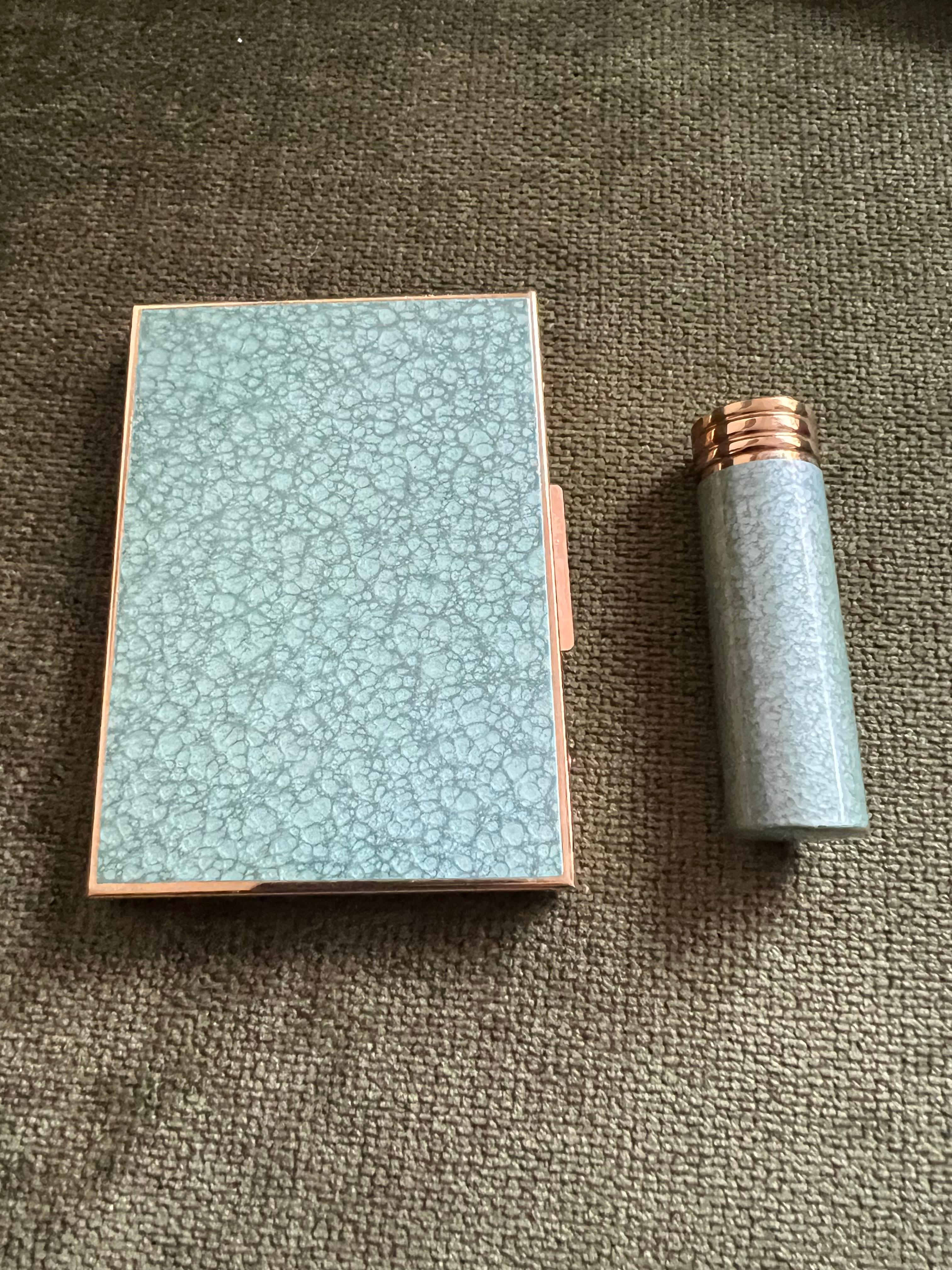 Ronson Enameled Cigarette Case & Lipstick Set
Circa 1960s
There is a place for a lighter as well, but the original lighter is missing. 
The lipstick case and the cigarette case are in fantastic condition considering they are from the 60s.
There is a