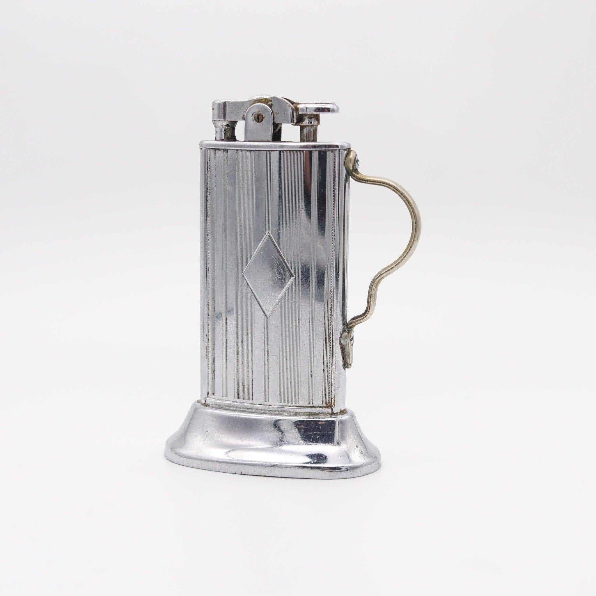 A Tabourette desk lighter designed by Ronson.

Very beautiful Tabourette desk lighter, created in New Jersey United States by The Ronson Co. during the art deco period, back in the 1927. This is a very unusual lighter, originally designed by Louis