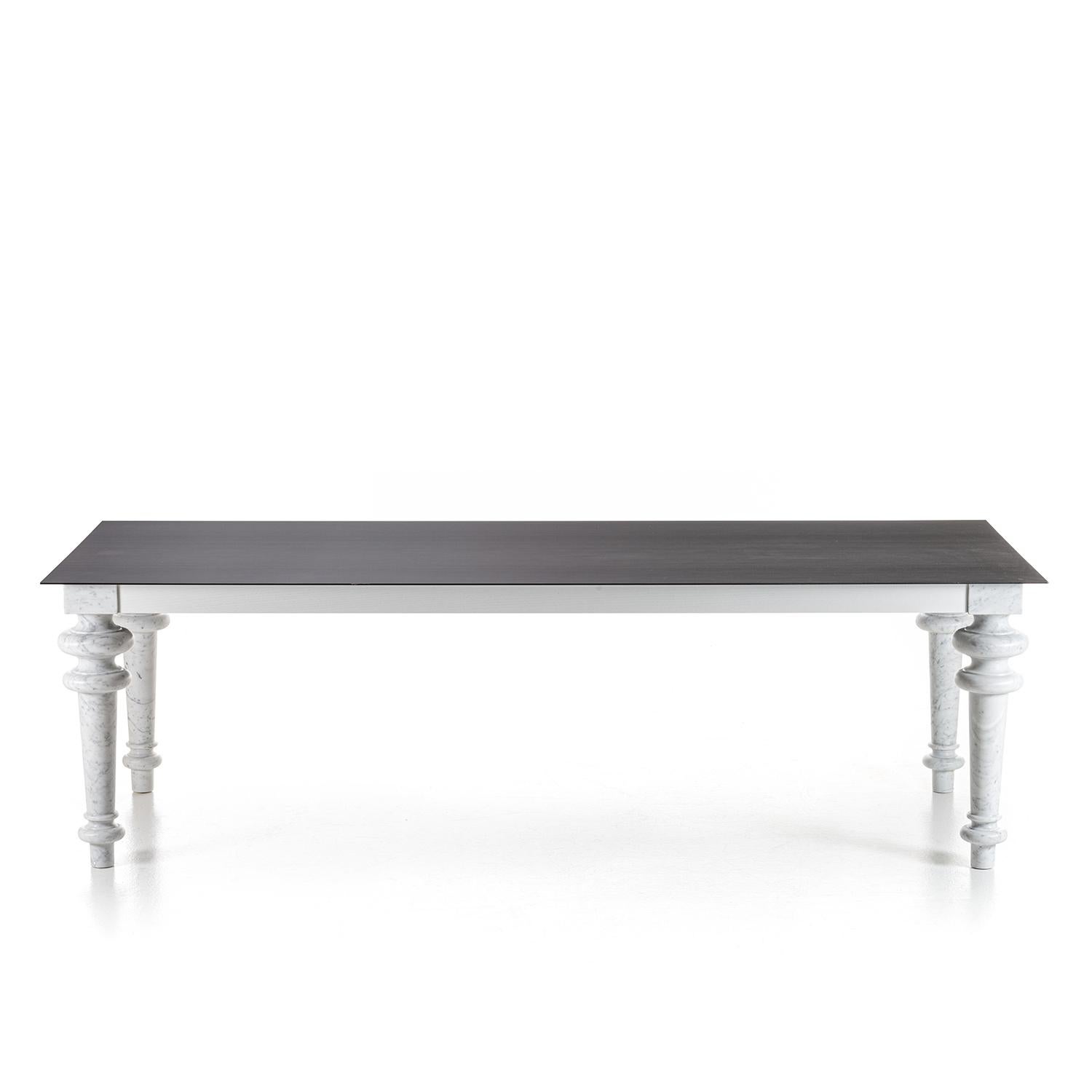 Rony dining table with waxed iron plate top, 4mm thickness,
fixed on white lacquered oak under top frame and with 4 feet
in polished white Carrara marble.
Also available with white Carrara marble top, 20mm thickness,
on request.