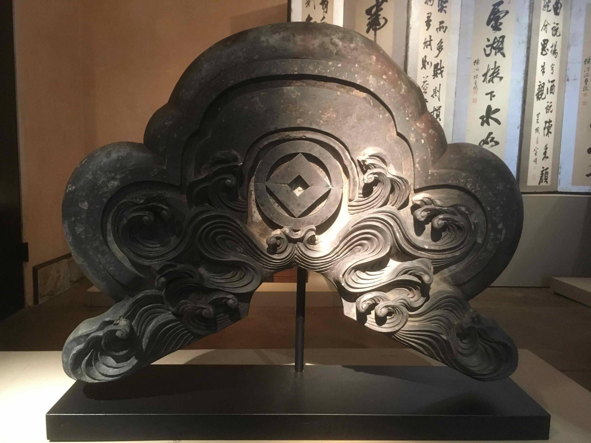Large roof tile with custom stand
Material: Clay 
Origin: Japan
Age: Late Meiji period, circa 1890
Size: 34