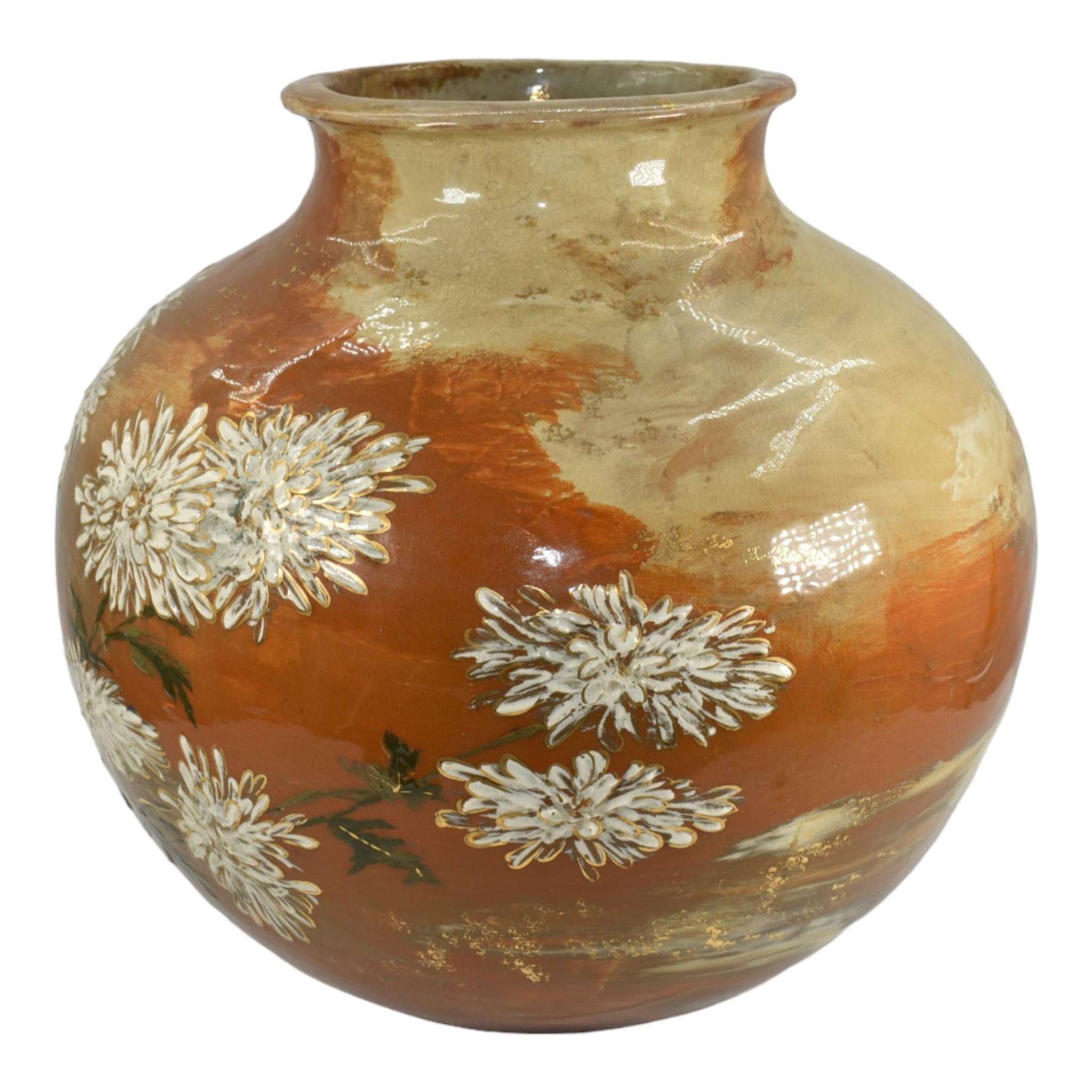 Rookwood 1833 Vintage Pottery Limoges Orange Chrysanthemum Jardiniere Fry
Massive, museum quality limoges glaze bulbous jardiniere, hand painted with white chrysanthemum flowers and gold accents by Laura Fry in 1883. 
Excellent condition.