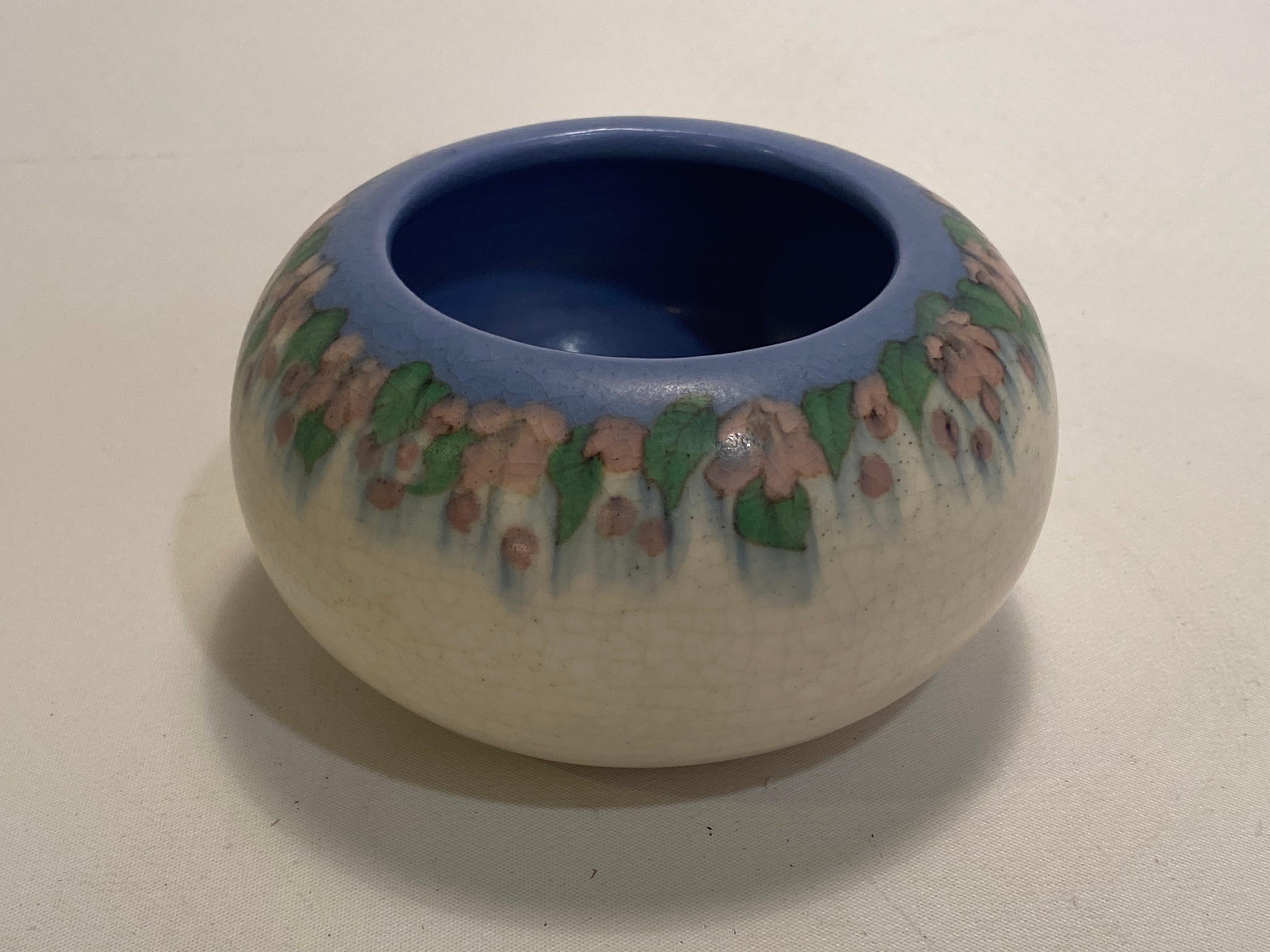 A beautiful American Arts & Crafts Rookwood floral vellum pottery bowl decorated by Mary Grace Denzler (1892-1991), Cincinnati, Ohio. Earthenware body with a matte vellum glaze. Shape number 214 . 'V' is for vellum glaze. Impressed factory marks and