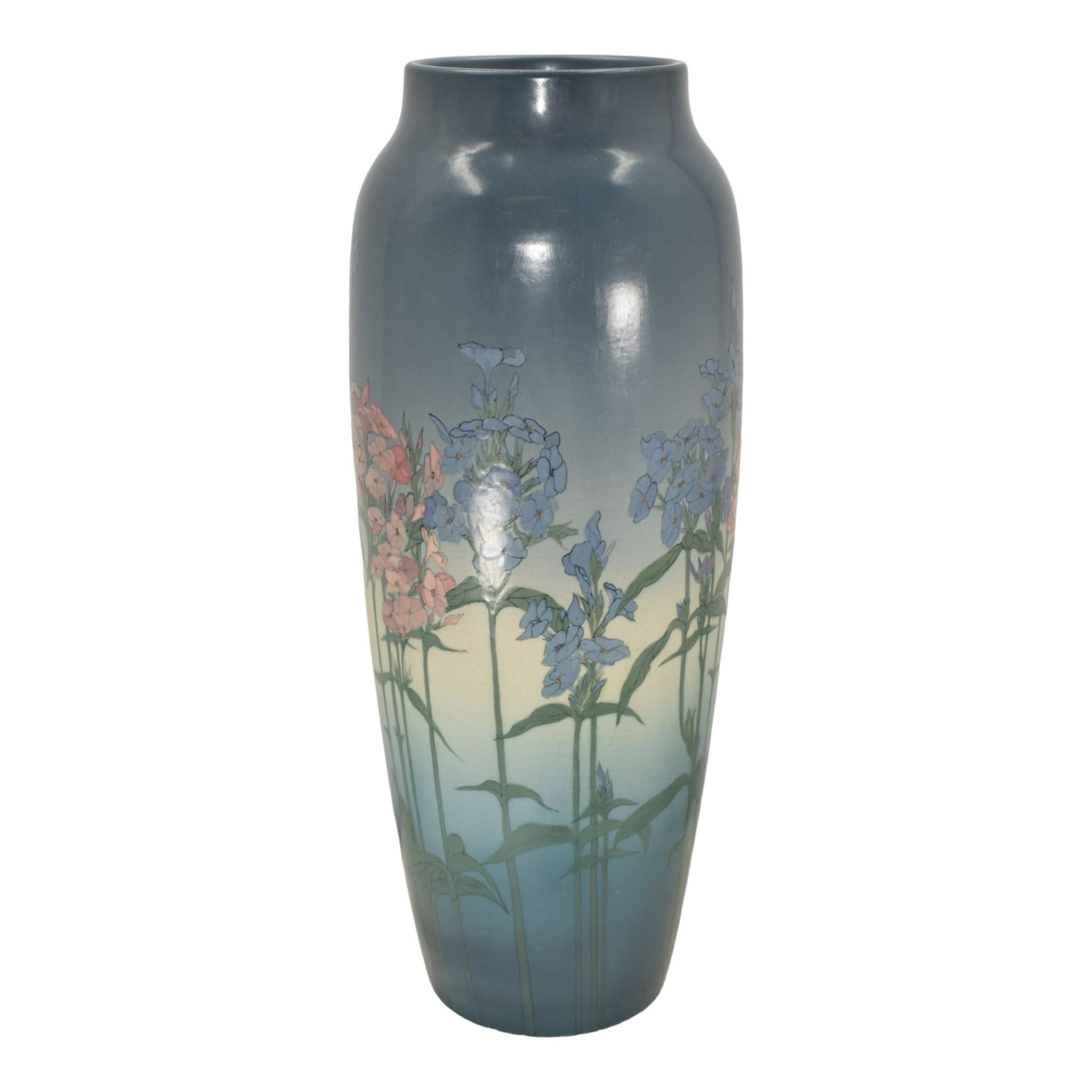 Rookwood 1920 Vintage Art Pottery Blue Vellum Ceramic Floor Vase 907A (Epply)
Large and stunning floor vase decorated with a beautiful and colorful floral design that goes around the perimeter of the body by Lorinda Epply.
Great colors and