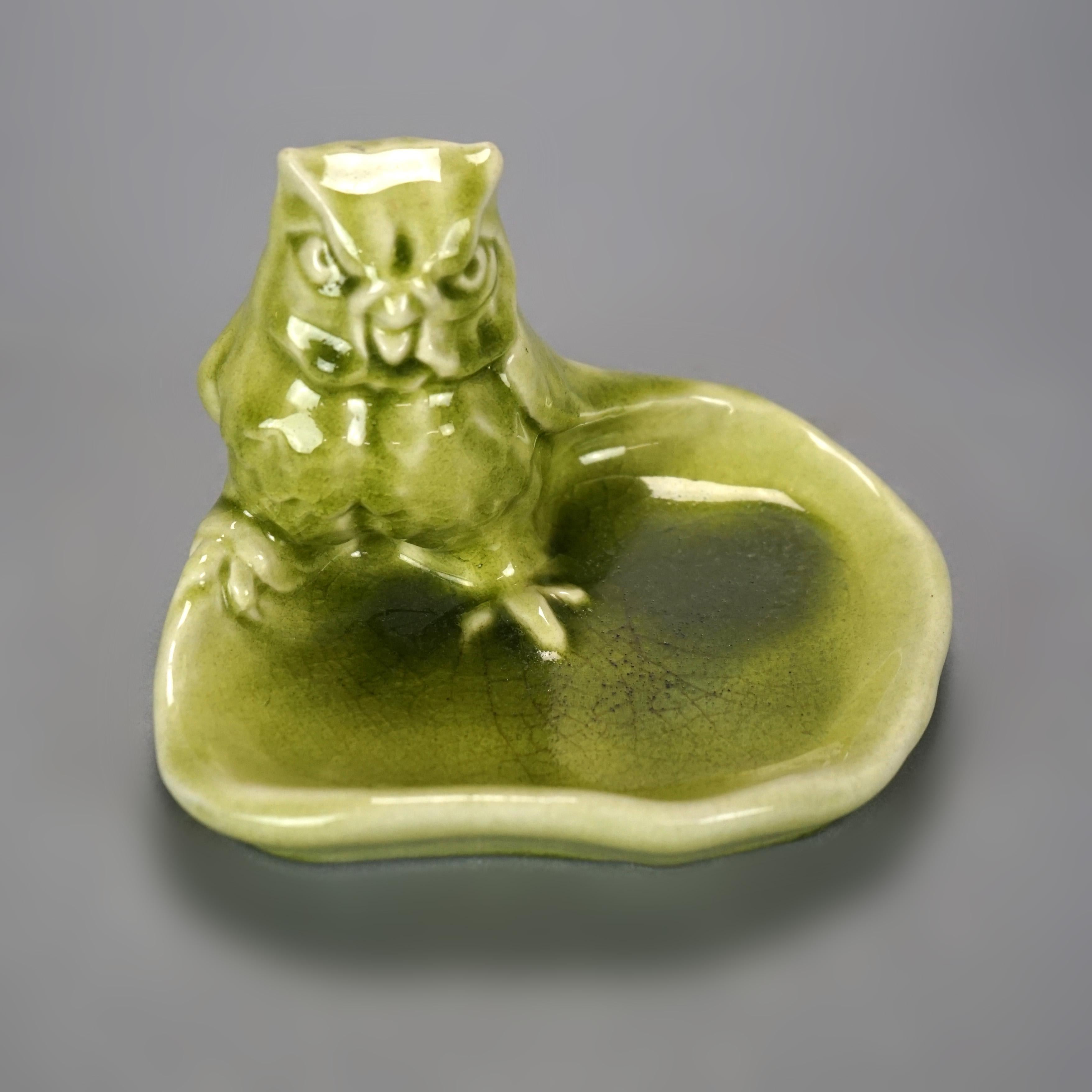 A figural dresser tray by Rookwood offers art pottery construction with owl and bowl, maker mark on base as photographed, dated 1948

Measures- 4.5''H x 6.5''W x 5.5''D.