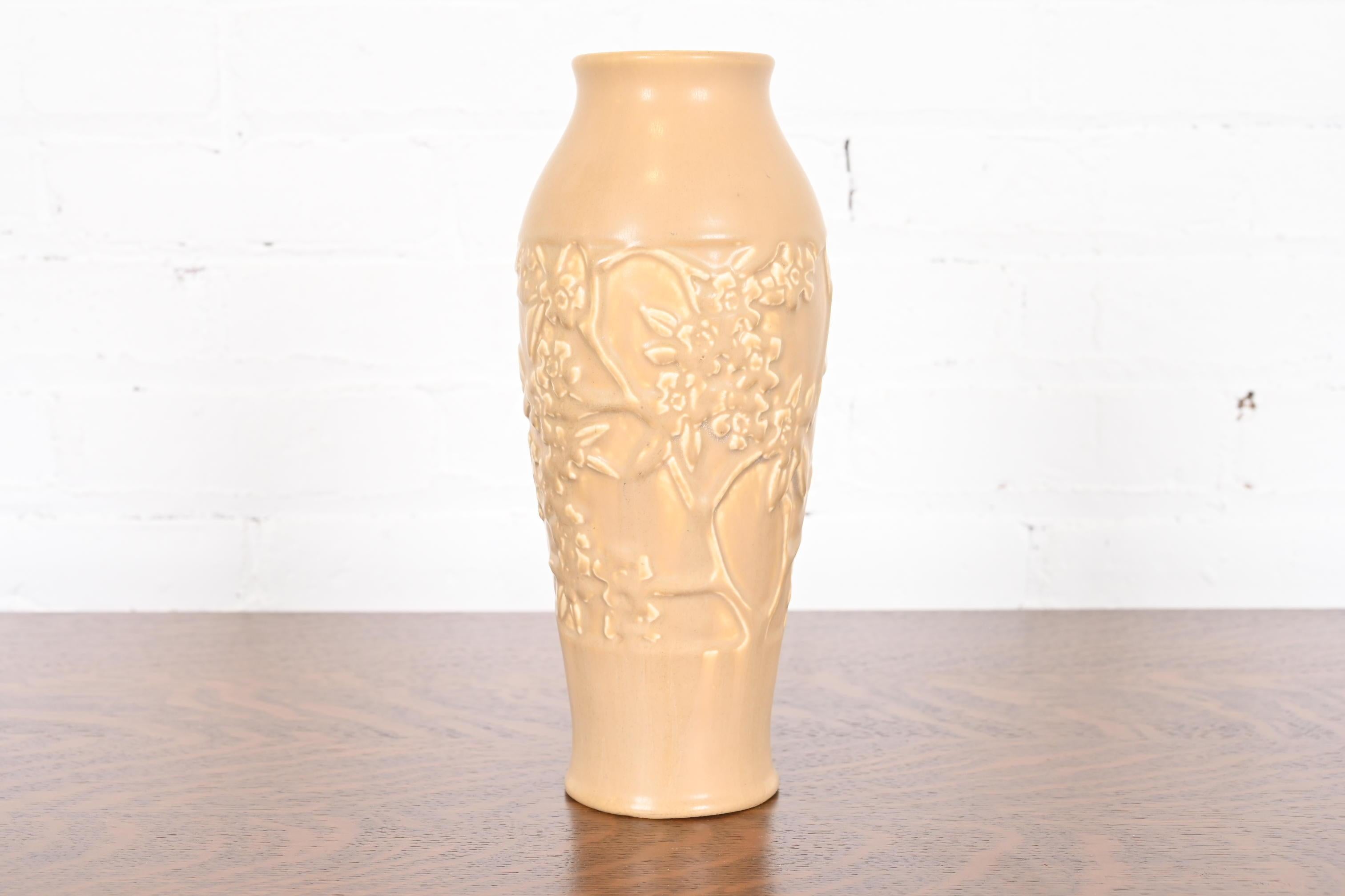 A gorgeous Arts & Crafts period large glazed art pottery vase with dogwood decoration

By Rookwood Pottery

USA, 1922

Glazed ceramic in a beautiful light tan color.

Measures: 4.25
