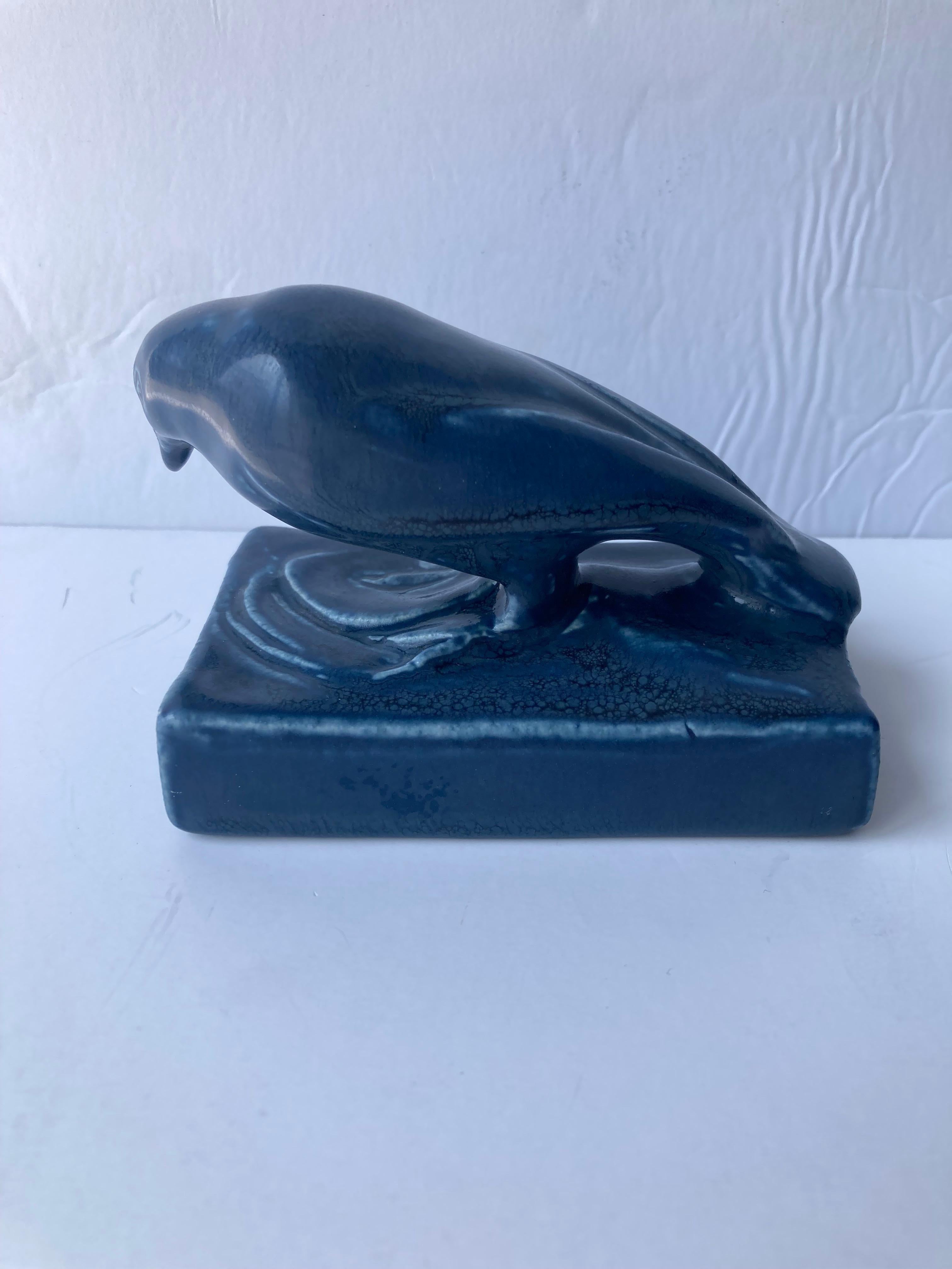 Beautiful Rookwood paperweight of a pottery Rook bird symbol of the Rookwood Pottery Co, model 1623 and dated 1921 in roman numbers XXI. Plus flame Mark.