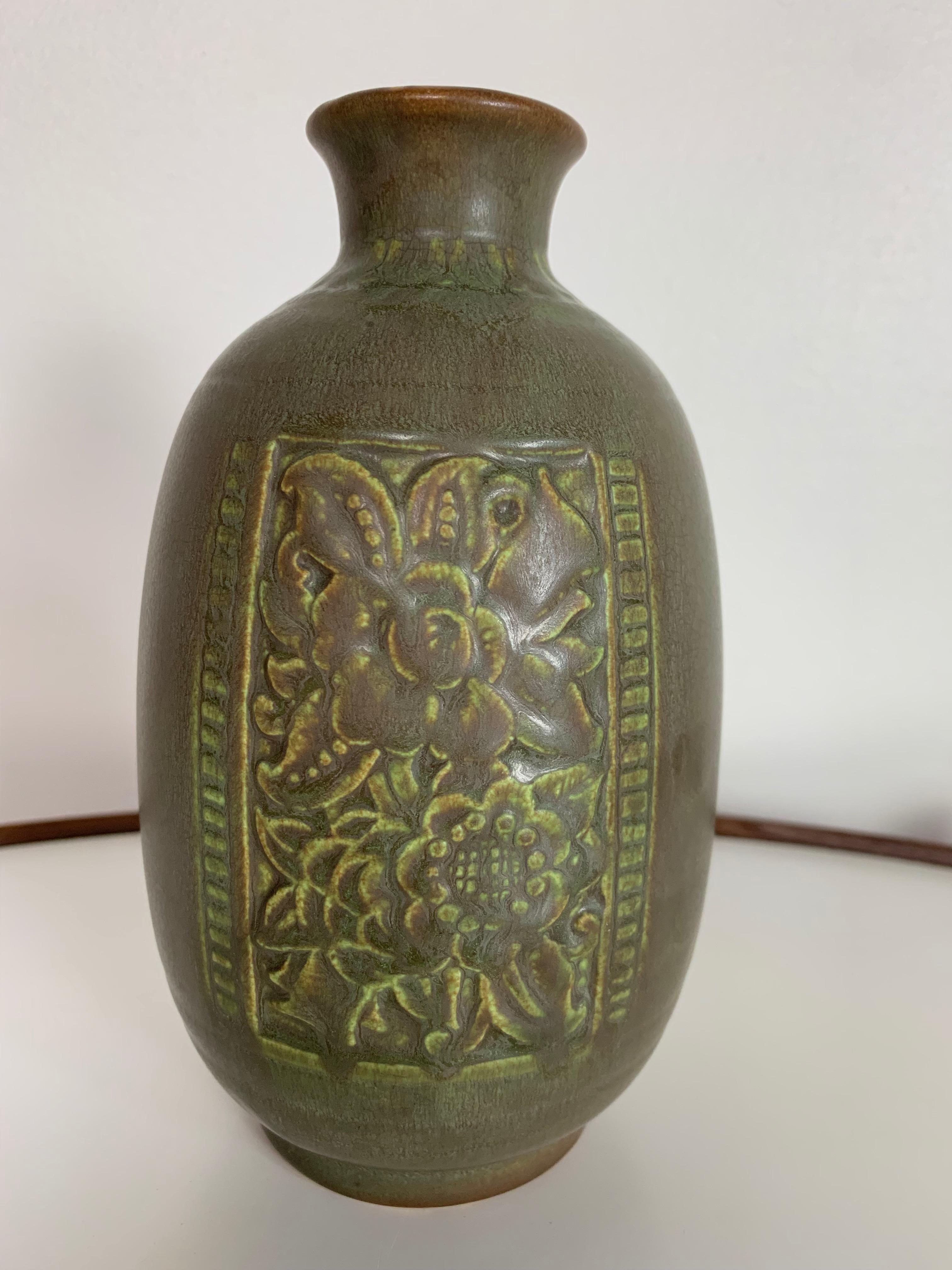 Lovely chartreuse matte glazed vase with two incised floral panels. Incised rookwood mark along with the number 6376, XXXIII, and CCL for Clara Christina Lindeman.