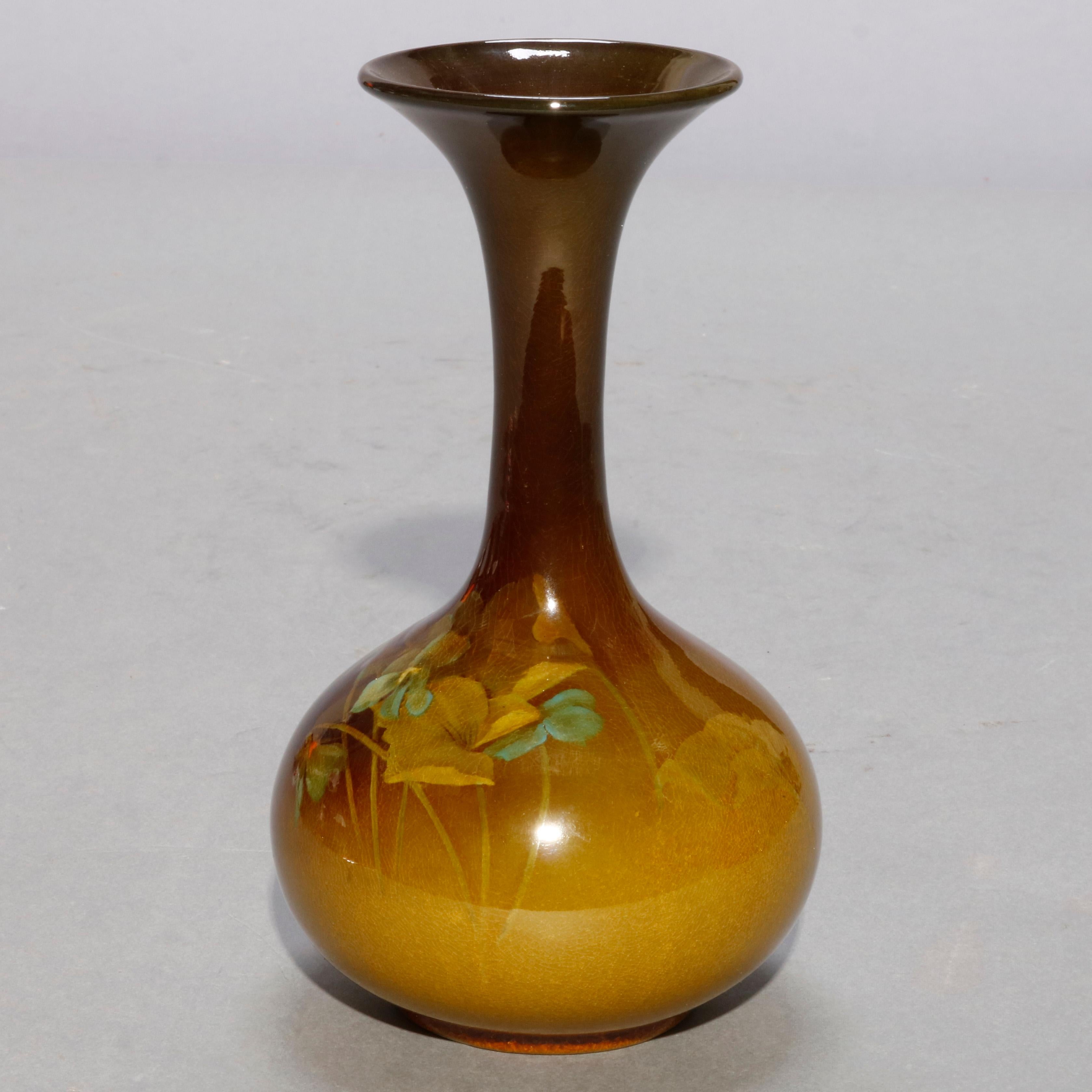 An antique artist-signed art pottery vase by A. D. Sehoun of Rookwood offers bulbous form with extended neck and wide mouth having standard glaze with hand painted floral decoration, maker stamp and artist signature on base Signed A.D. Sehoun, circa
