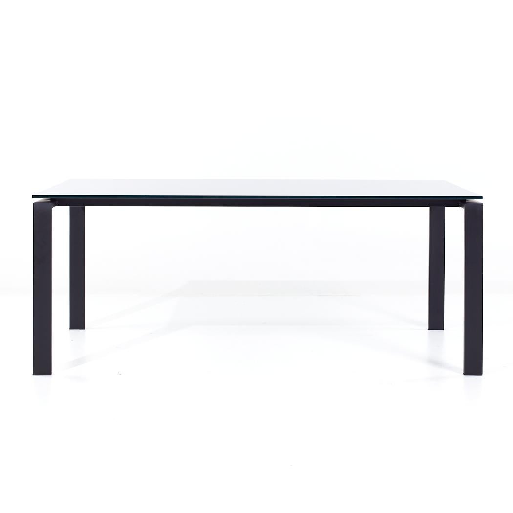 Room & Board Contemporary Black Glass and Metal Dining Table

This dining table measures: 72 wide x 36 deep x 29 inches high, with a chair clearance of 28.25 inches

About Photos: We take our photos in a controlled lighting studio to show as much