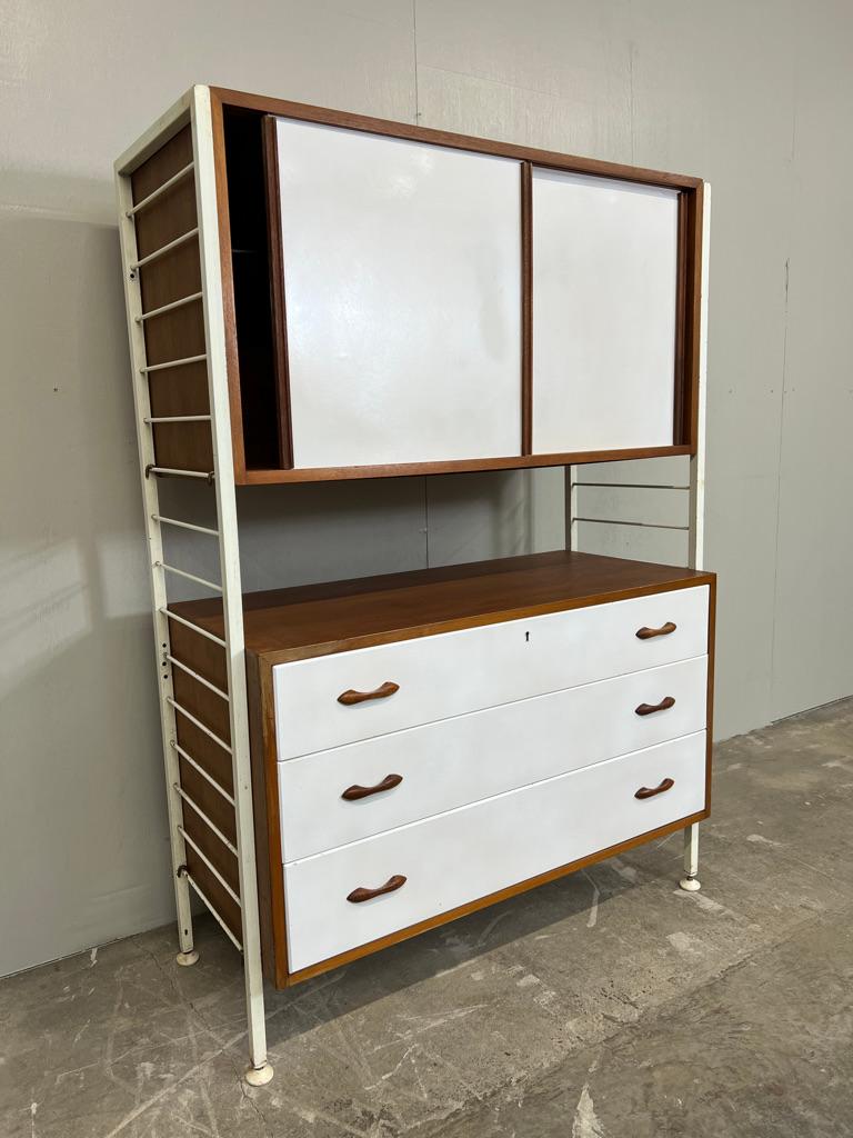 A vintage freestanding sought after shelving system by Staples from the 1960’s as retailed in Heals of London. This is one of the only freestanding units in this configuration available today
Impressive Mid Century design with matt white steel