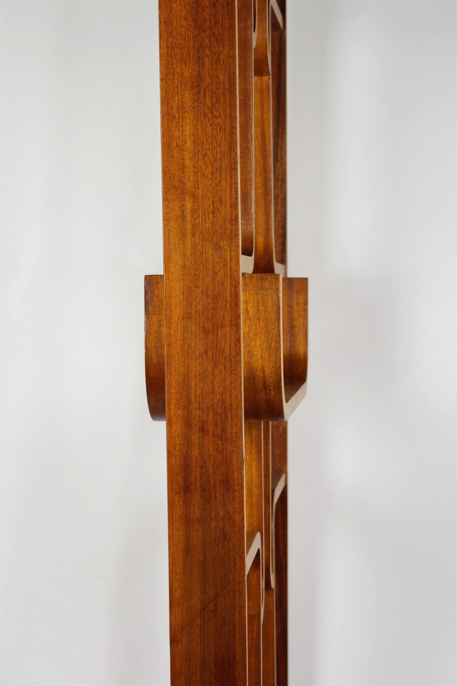 This room divider from the 1960s was designed for Drevopodnik Holešov by Ludvik Volák.
It is made from veneered bent plywood and the legs can be removed (then the height is 225cm).