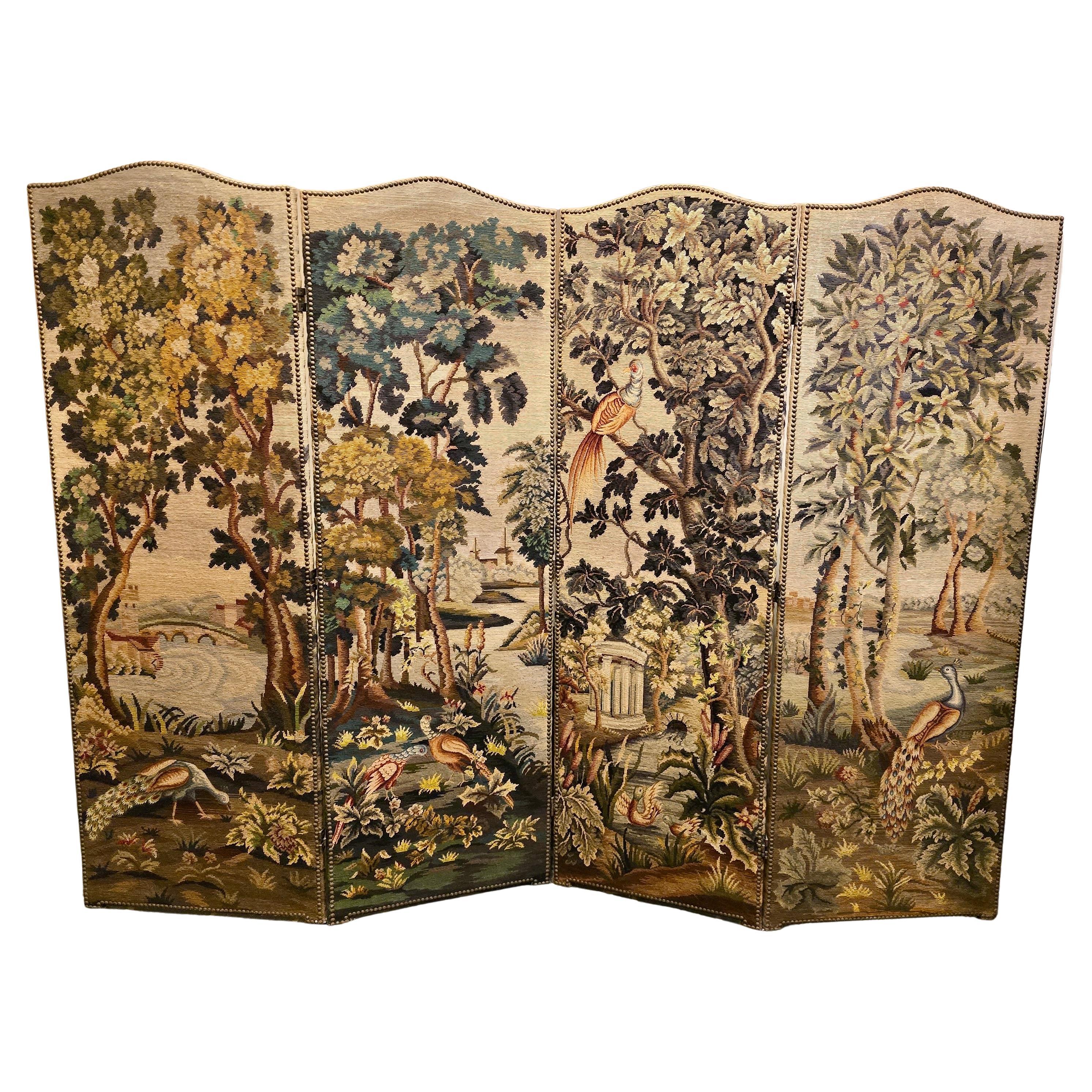 Four Panel Room Divider Screen with Aubusson Carpets - 20th Century

A beautiful four panel room divider decorated with fine Aubusson carpets depicting a lush Italian landscape. This early 20th century masterpiece features a rich composition of
