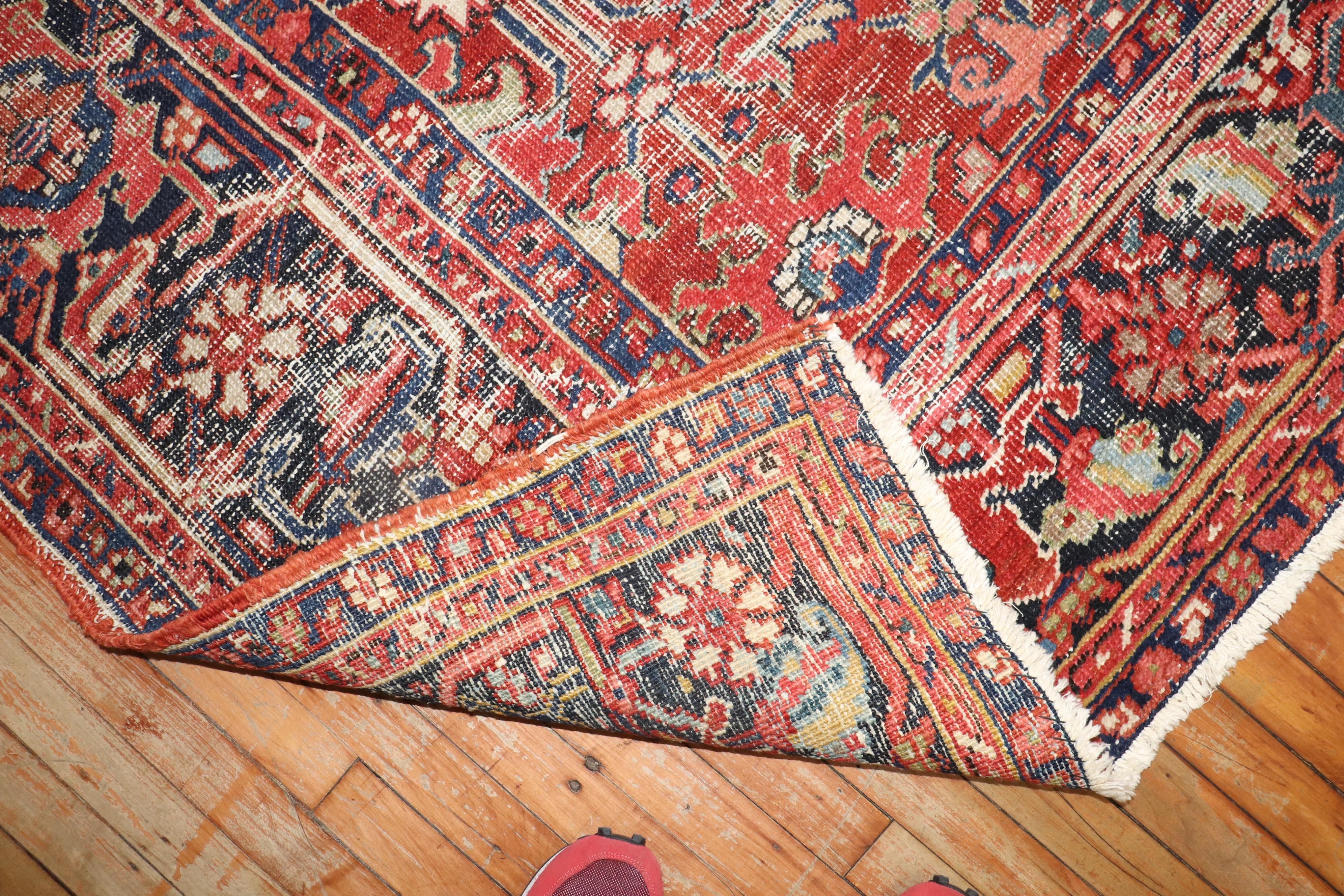 Zabihi Collection Worn Room Size Antique Persian Heriz Rug In Distressed Condition In New York, NY