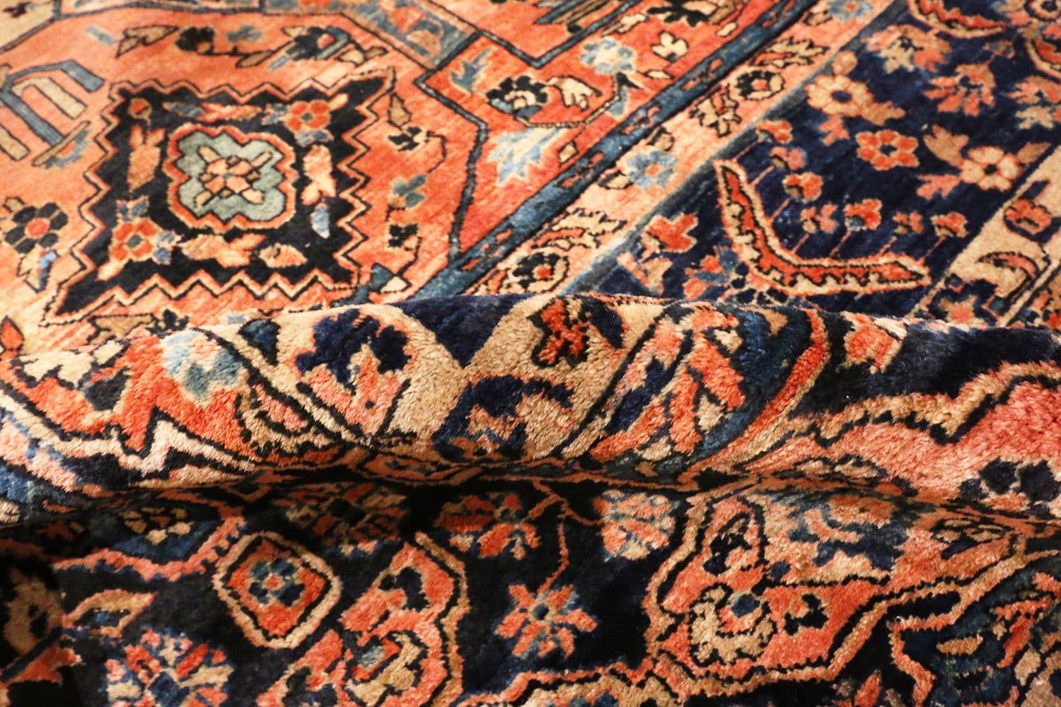 A beautiful Jewel tone colored room size antique Persian Sarouk rug, country of origin / rugs type: Antique Persian rugs, date: circa 1920.