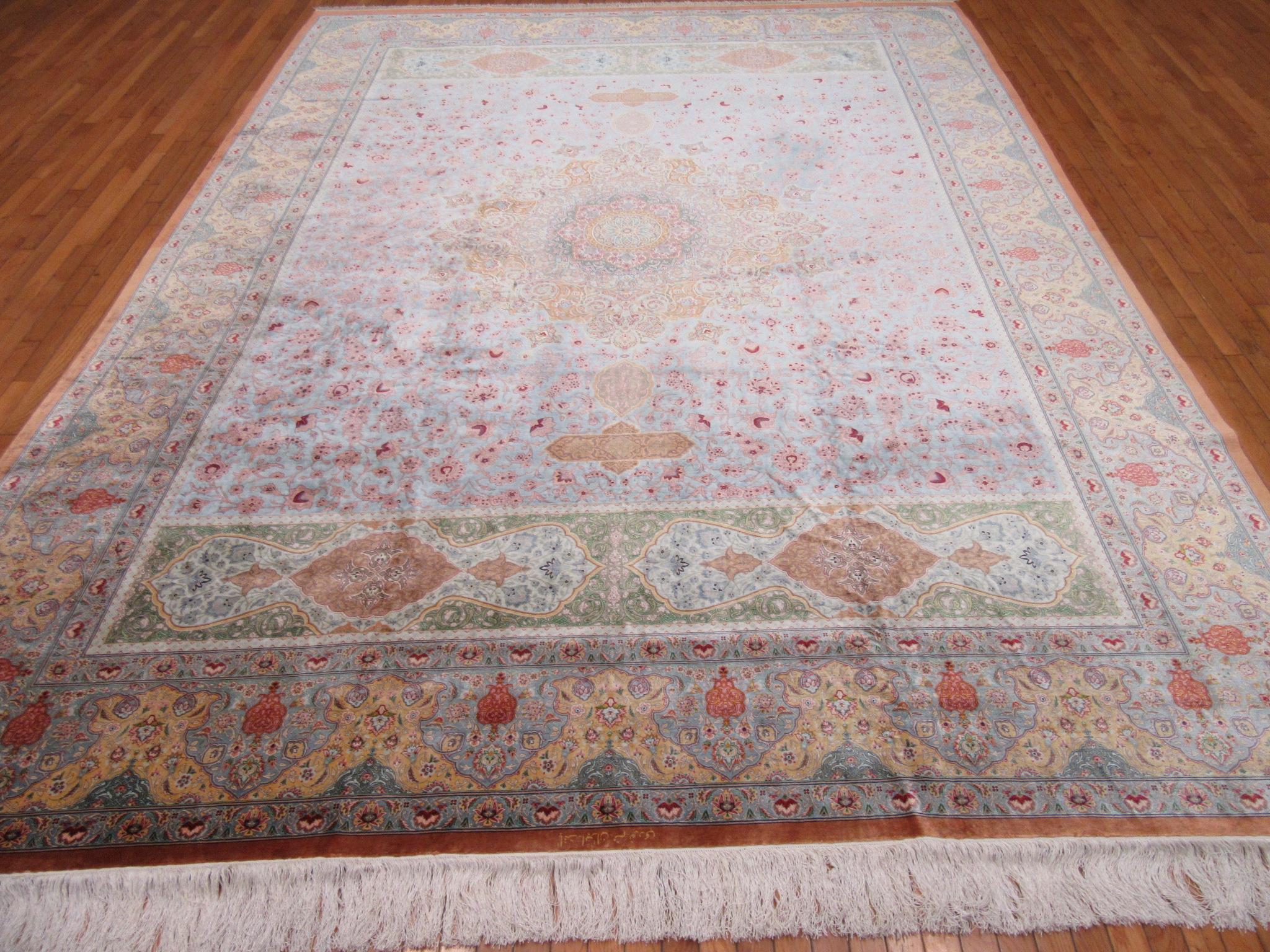 This is a very high density hand knotted pure silk rug from the infamous city of Qume in central Iran (Persian).
It has the classic intricate and detailed floral design executed in a roughly 900 knots per square inch weave.
The rug has medium