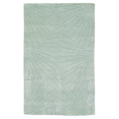 Alfombra moderna de lana tamizada a mano de color verde con motivos abstractos