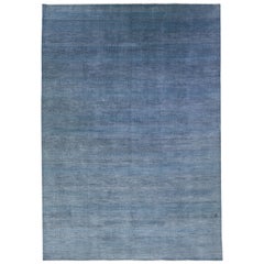 Tappeto moderno Savannah in lana con disegno geometrico blu, misura per la stanza