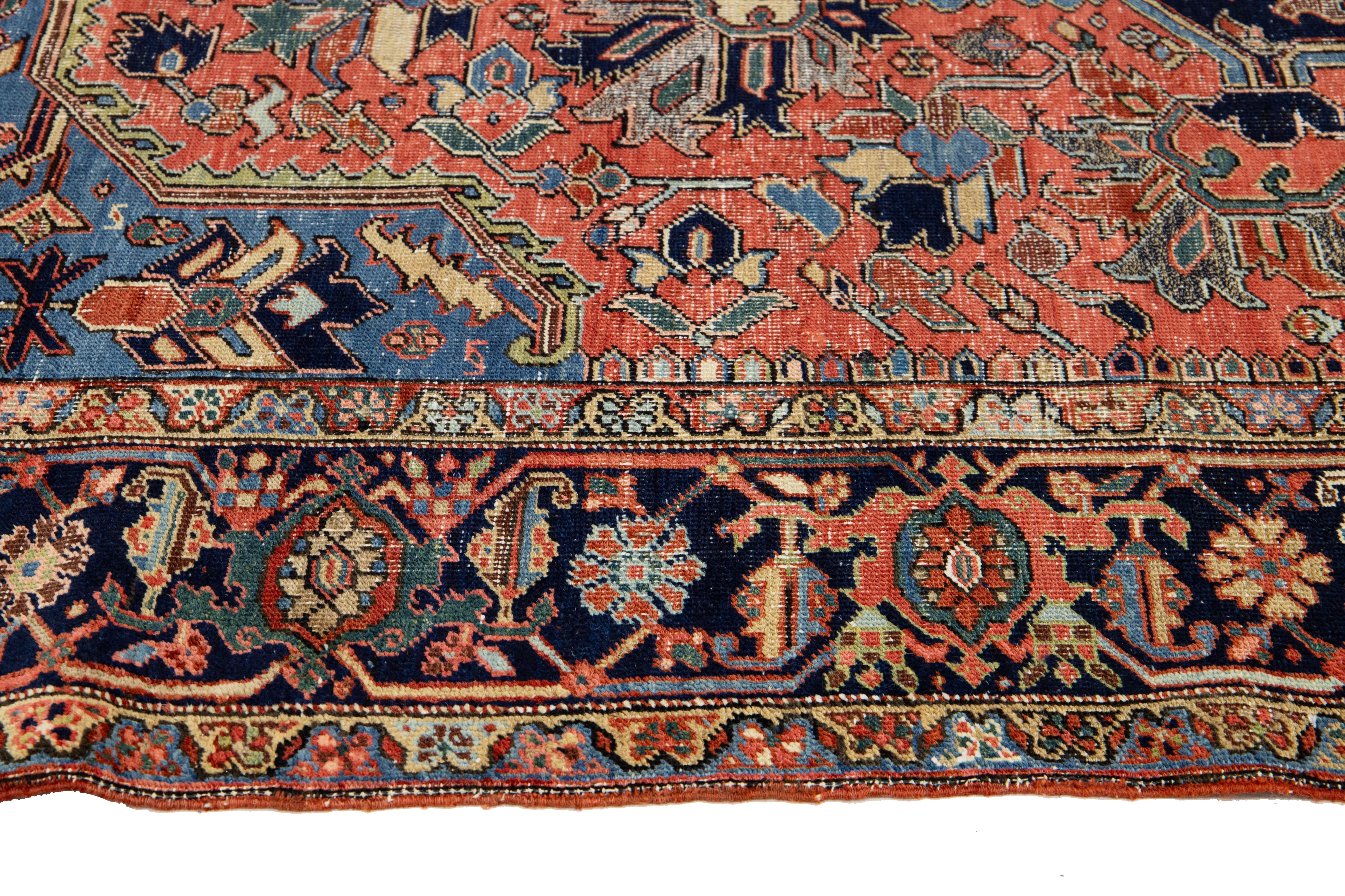 Room-Sized Antique Persian Heriz Rug in Red Wool Featuring a Medalllion Motif In Good Condition For Sale In Norwalk, CT